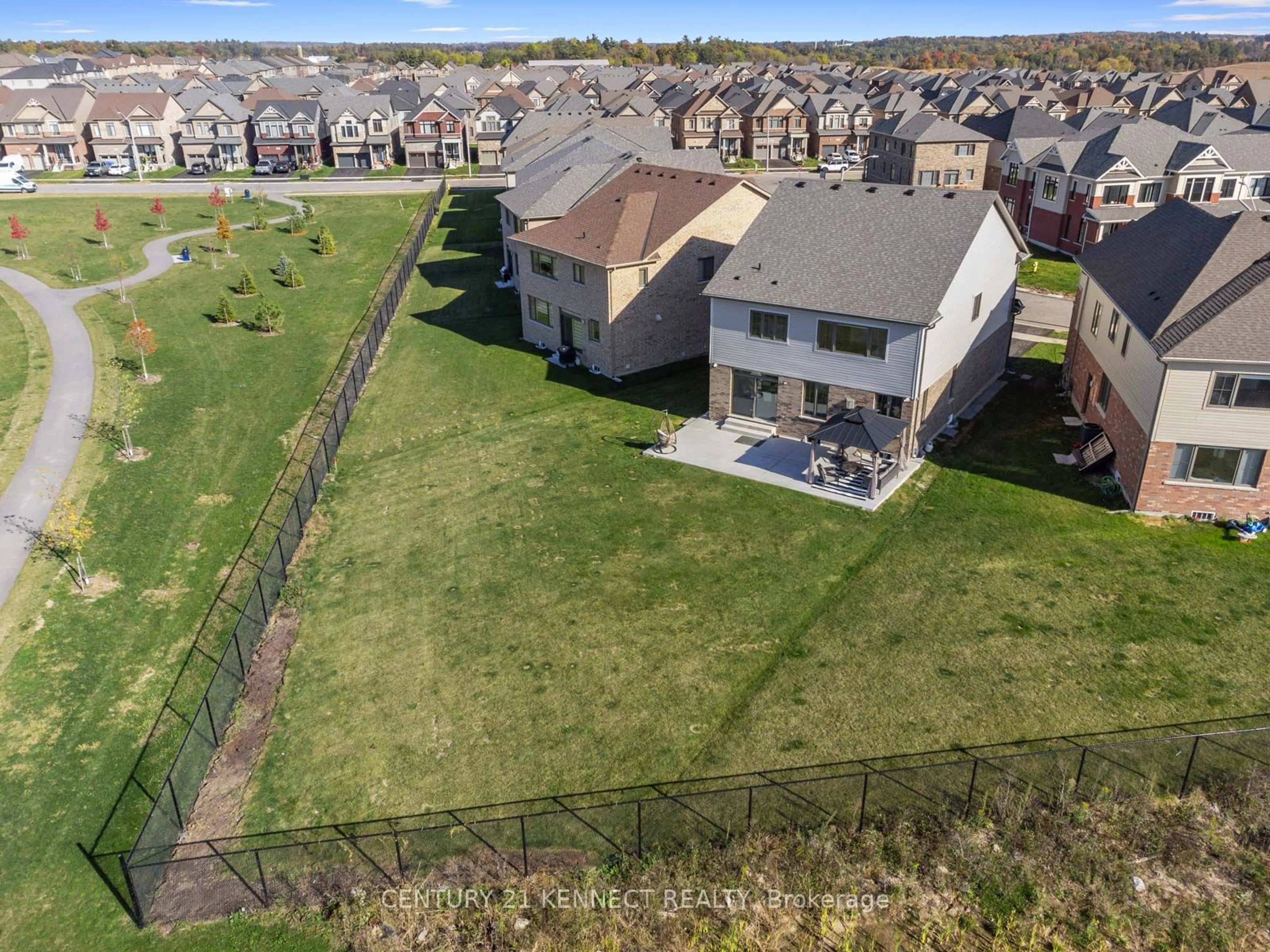 Frontside or backside of a home, the fenced backyard for 38 Mildred Gillies St, North Dumfries Ontario N0B 1E0