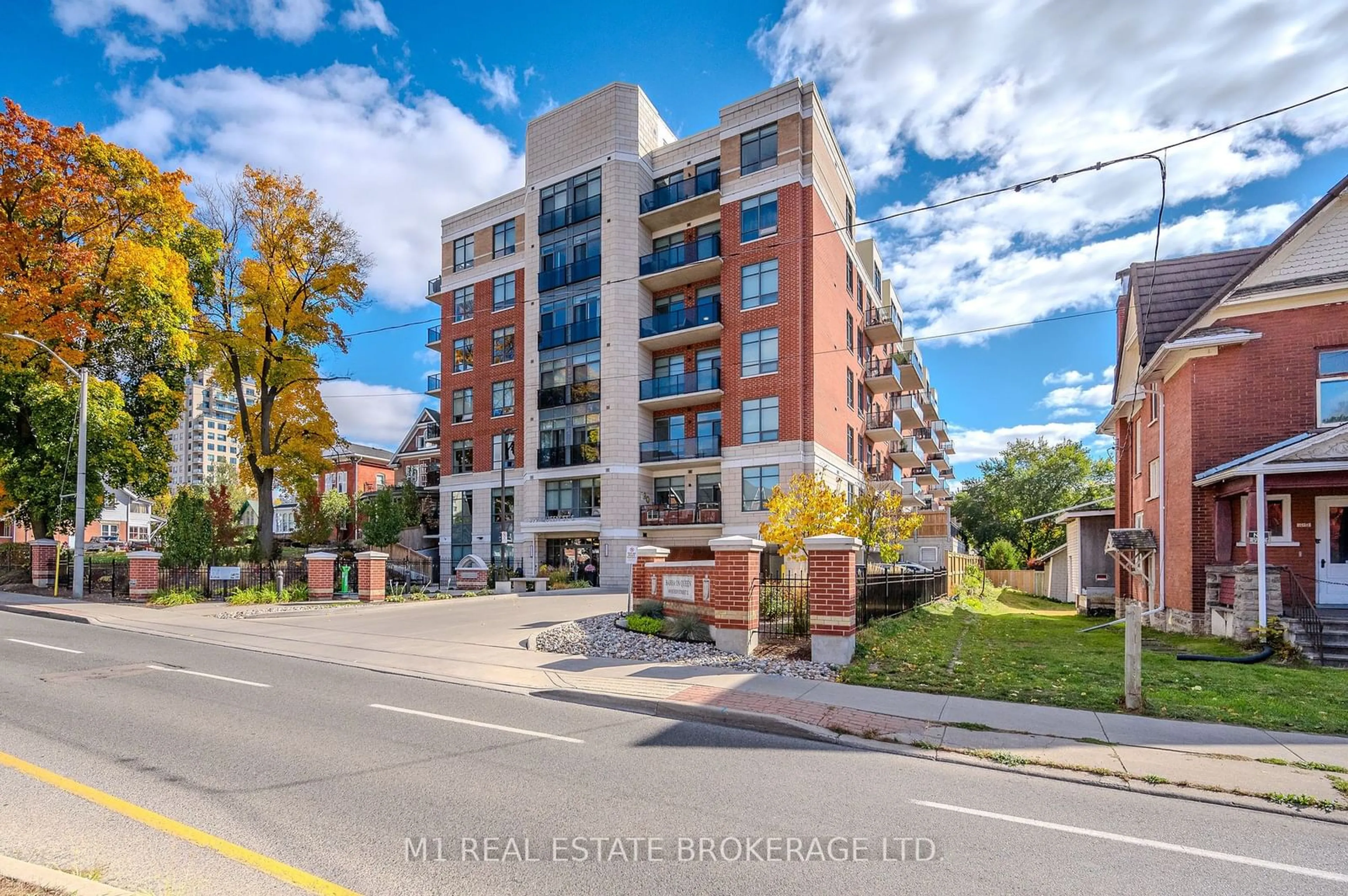 A pic from exterior of the house or condo, the street view for 399 Queen St #102, Kitchener Ontario N2G 0C4