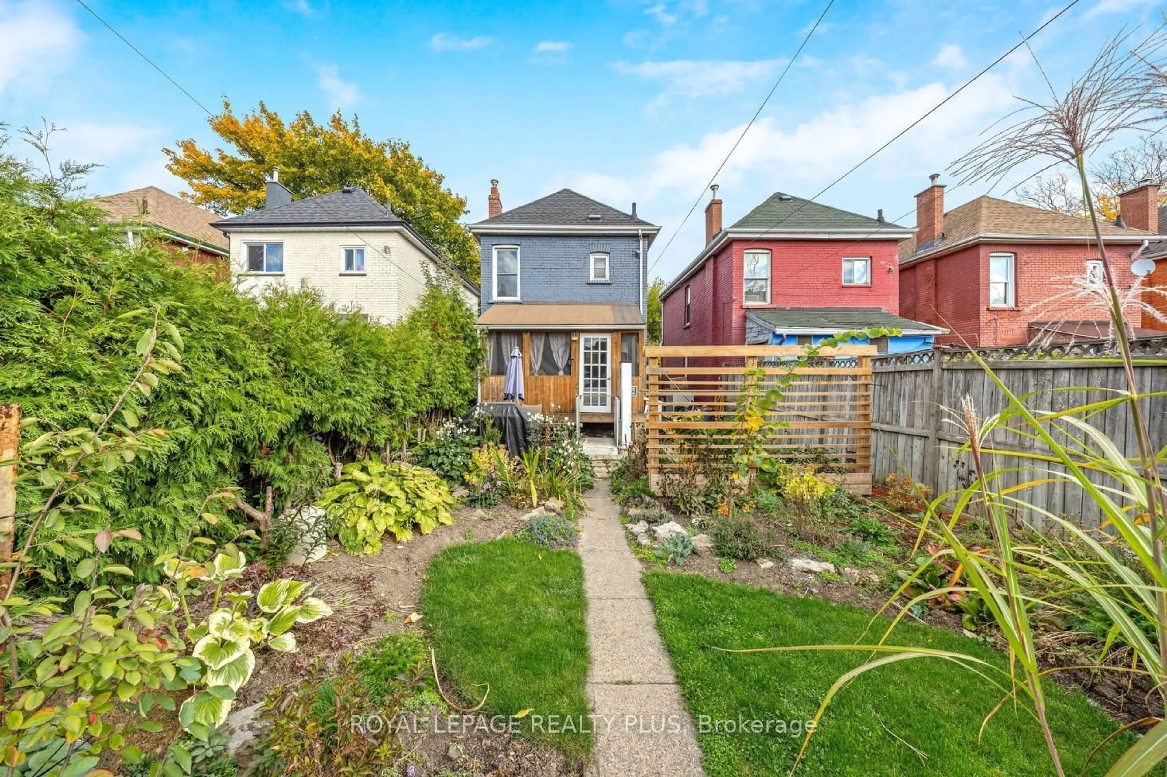 Frontside or backside of a home, the fenced backyard for 16 Case St, Hamilton Ontario L8L 3G7