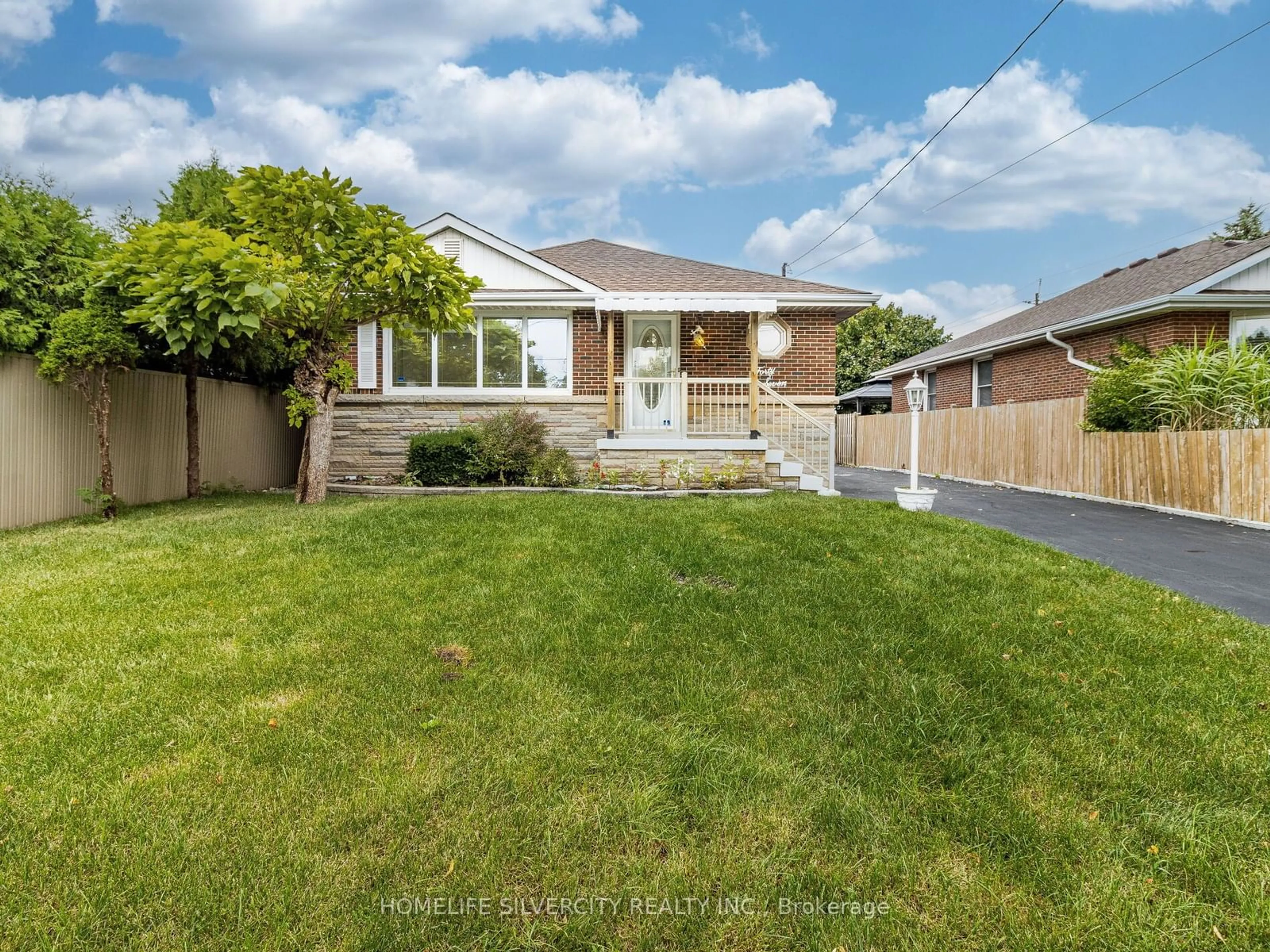 Frontside or backside of a home, the fenced backyard for 47 Alderney Ave, Hamilton Ontario L9A 2A6