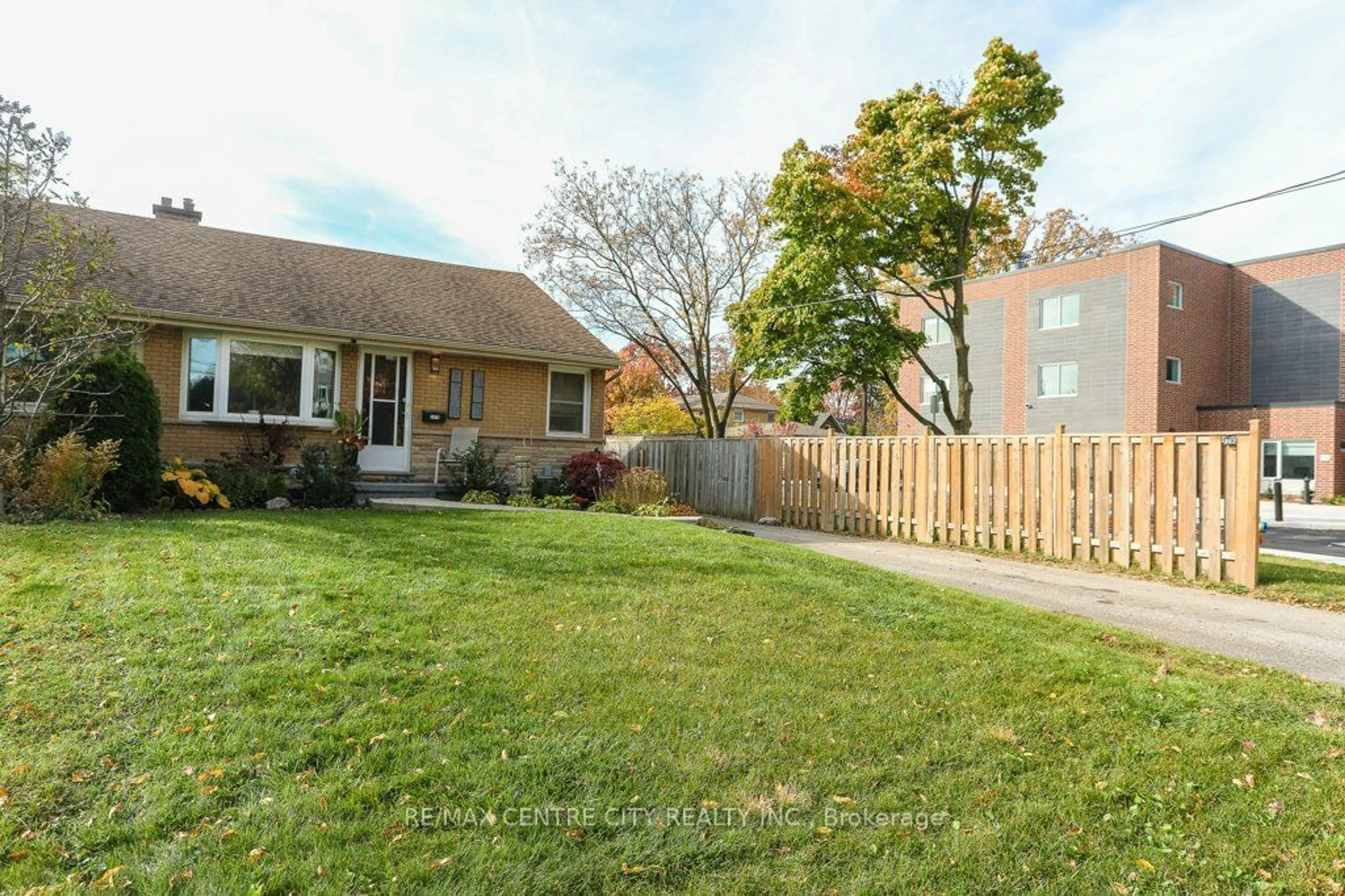 Frontside or backside of a home, the fenced backyard for 347 Sylvan St #B, London Ontario N6C 4L9