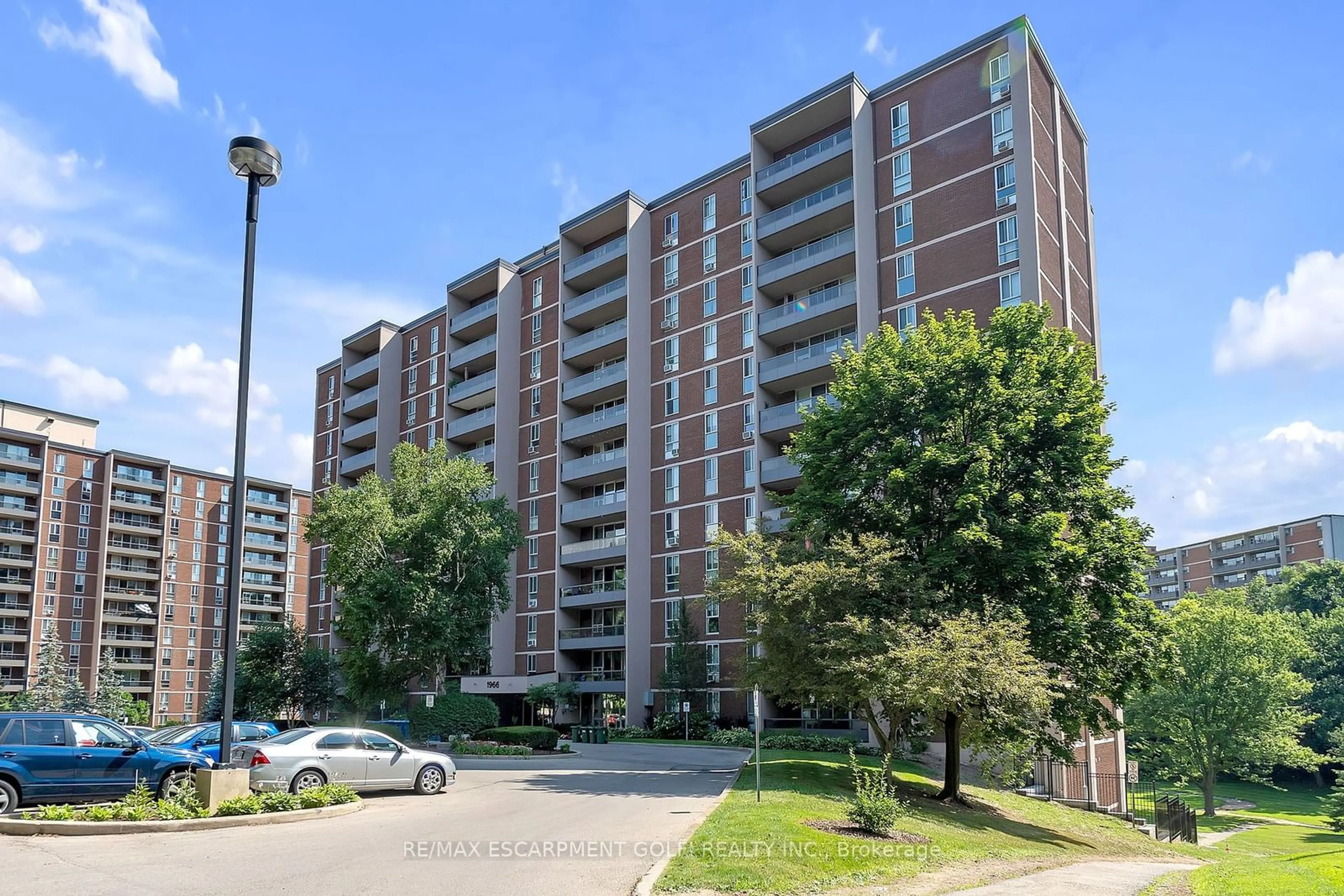 A pic from exterior of the house or condo, the street view for 1966 Main St #402, Hamilton Ontario L8S 1J6