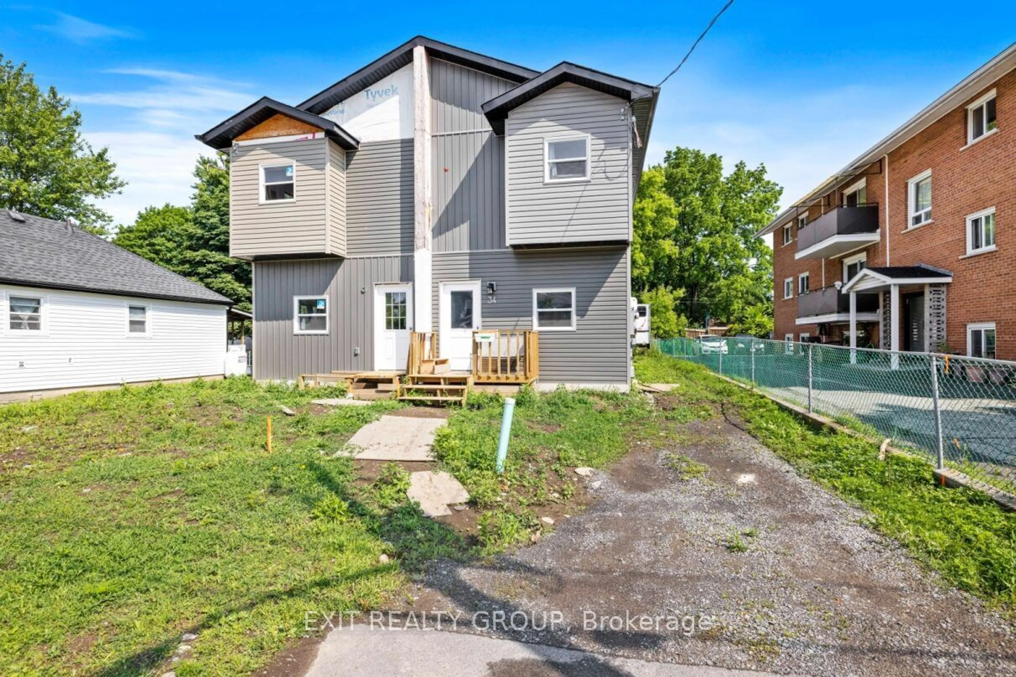 Frontside or backside of a home, the fenced backyard for 34 Strachan St, Belleville Ontario K8P 1W8