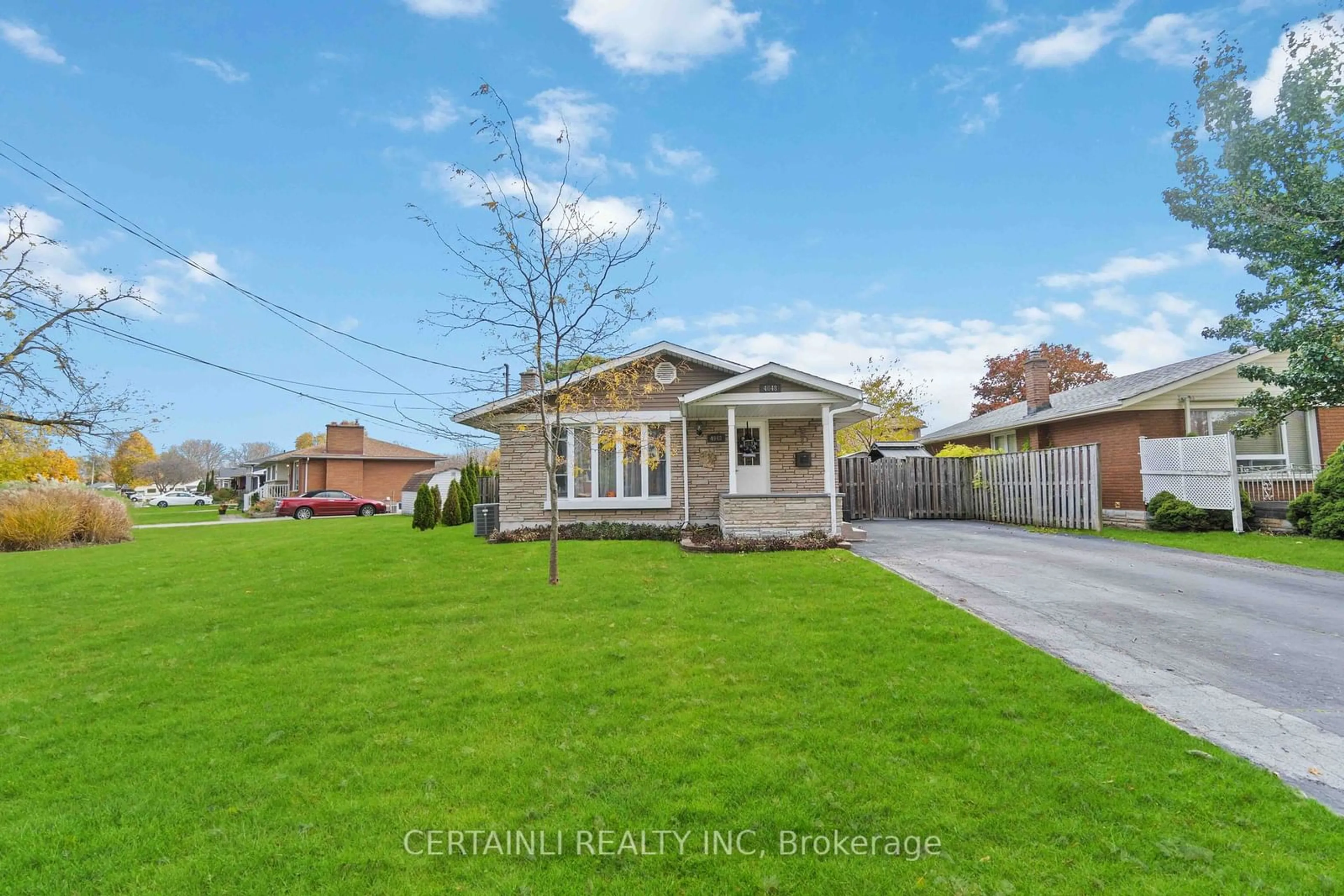 Frontside or backside of a home, the fenced backyard for 4048 Montcalm Cres, Niagara Falls Ontario L2G 6L8