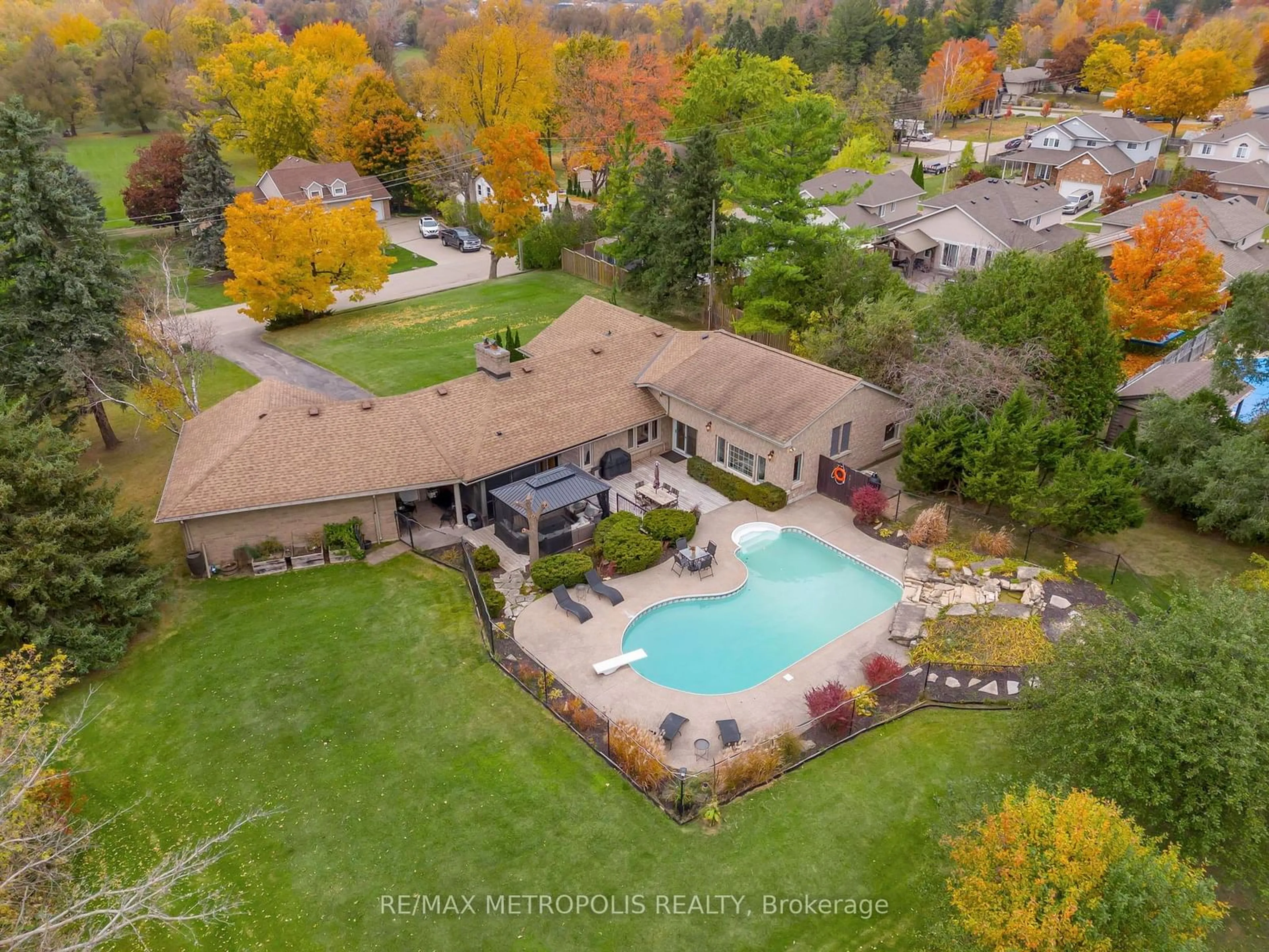 Frontside or backside of a home, the fenced backyard for 477 Fairview St, Wilmot Ontario N3A 1M6