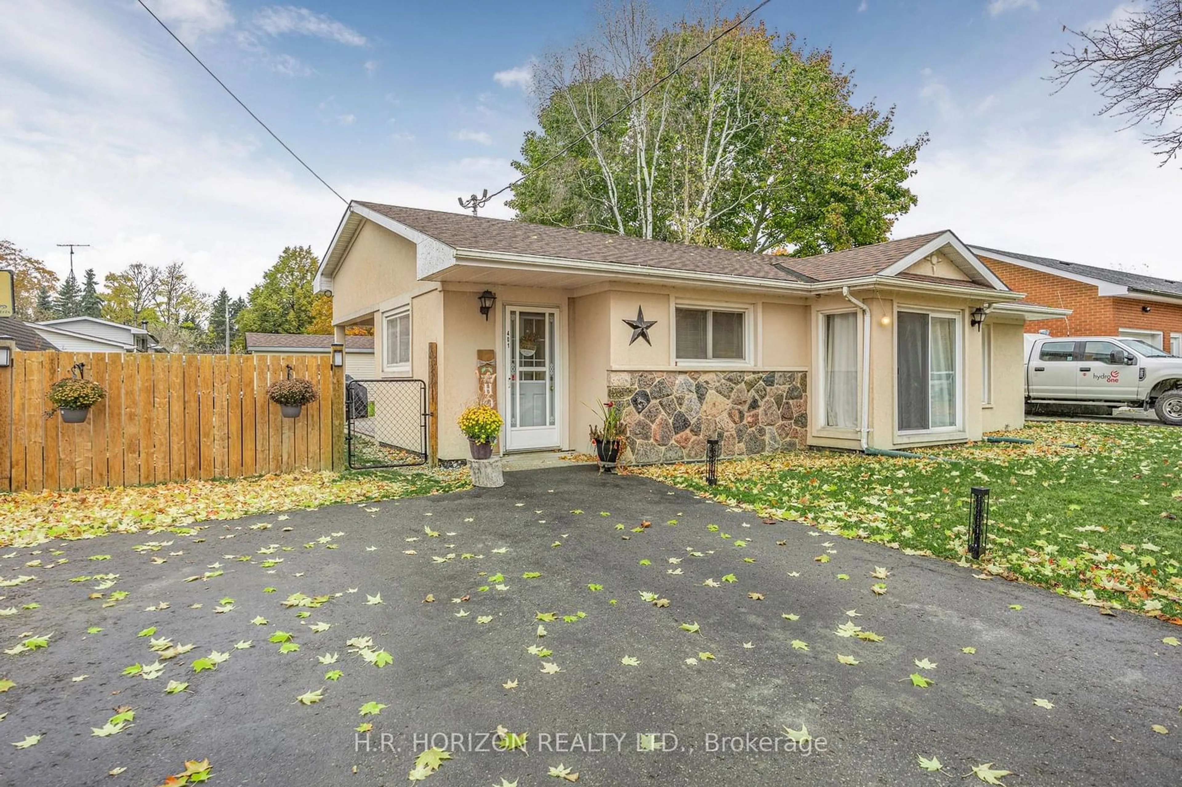 Frontside or backside of a home, the fenced backyard for 401 Main St, Southgate Ontario N0C 1B0