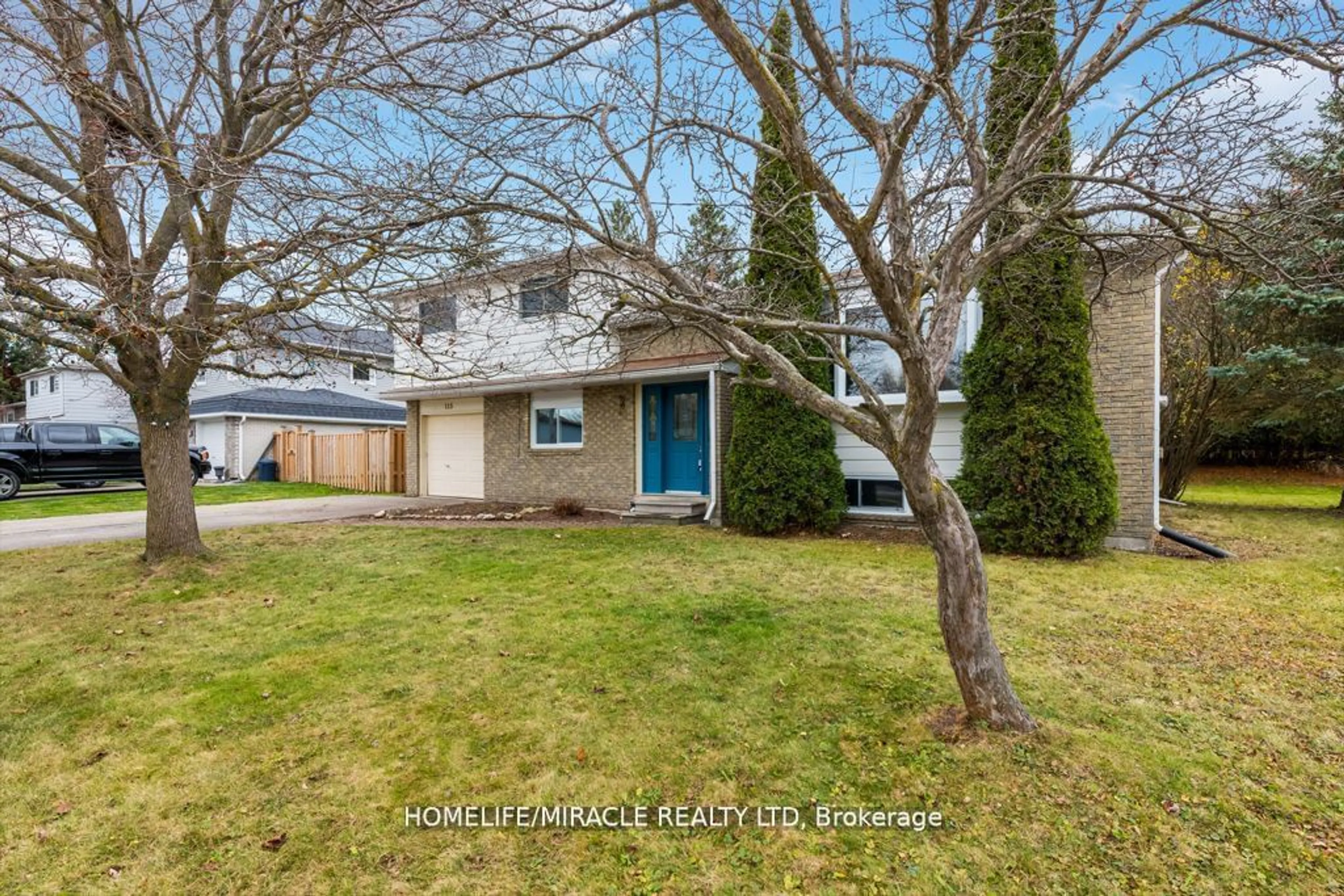 Frontside or backside of a home, the fenced backyard for 115 Gracie St, Shelburne Ontario L0N 1S1