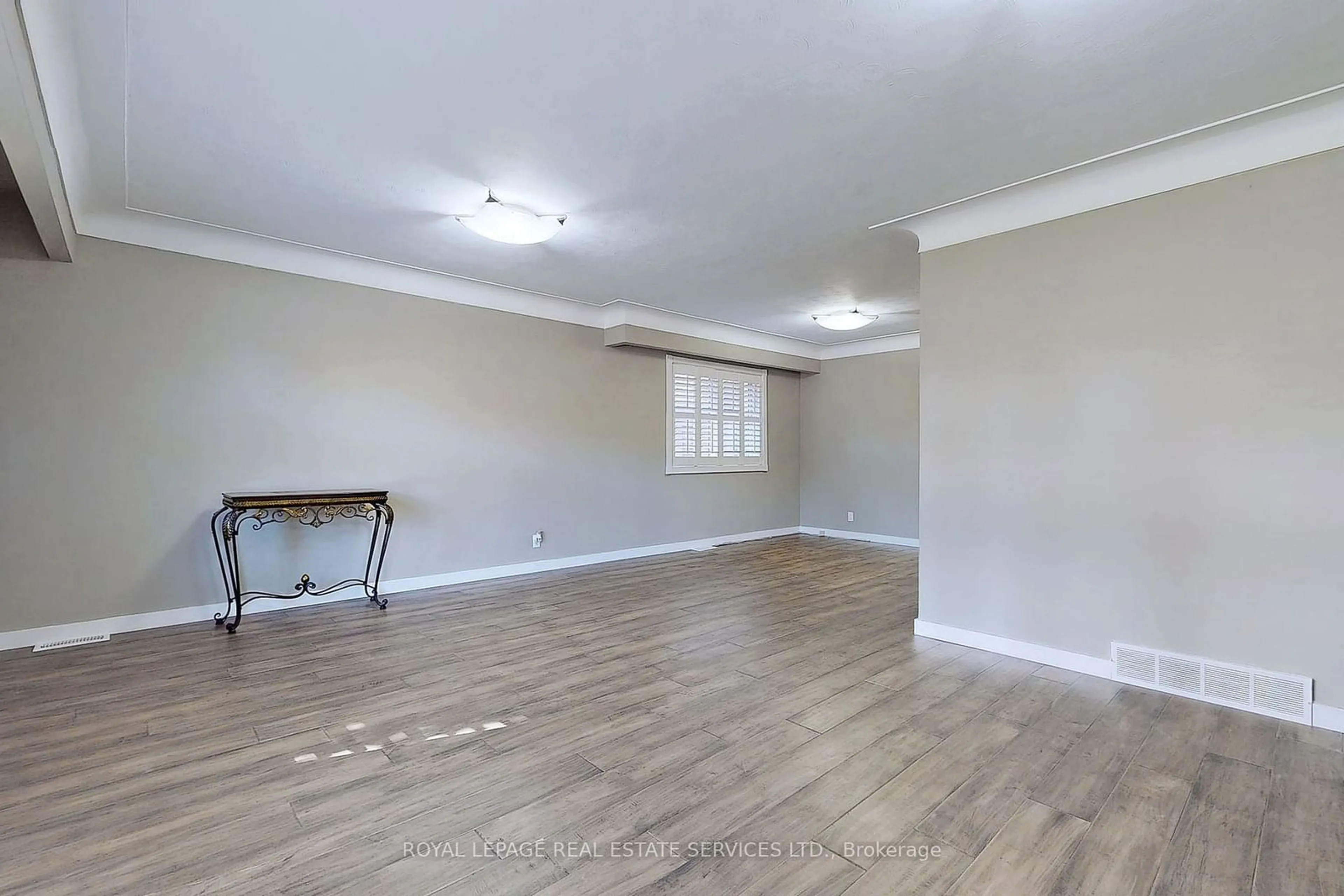 A pic of a room, wood floors for 4 Mcmaster Ave, Hamilton Ontario L9H 4M5