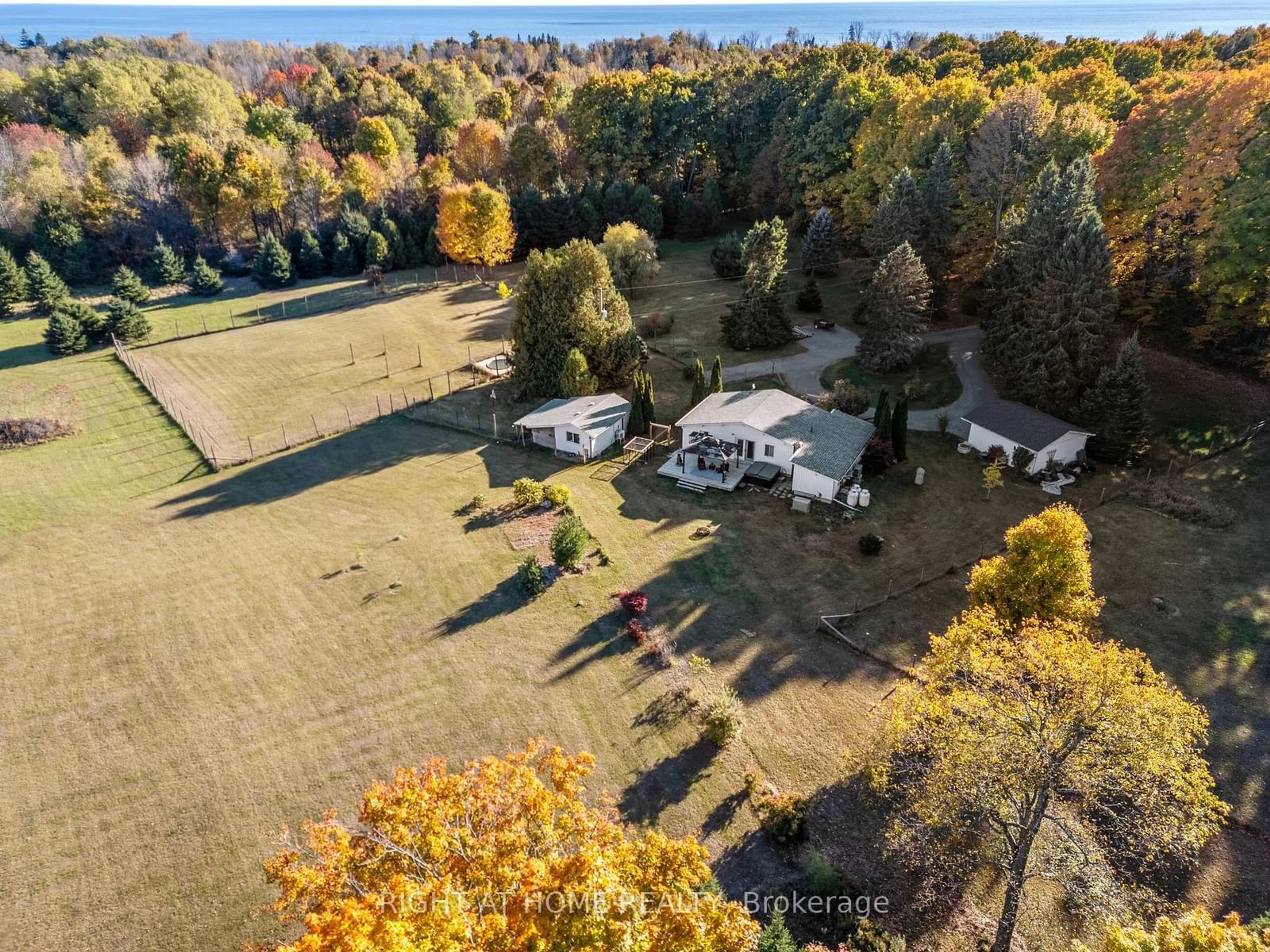 A pic from exterior of the house or condo, the fenced backyard for 203 Barnes Rd, Brighton Ontario K0K 1H0