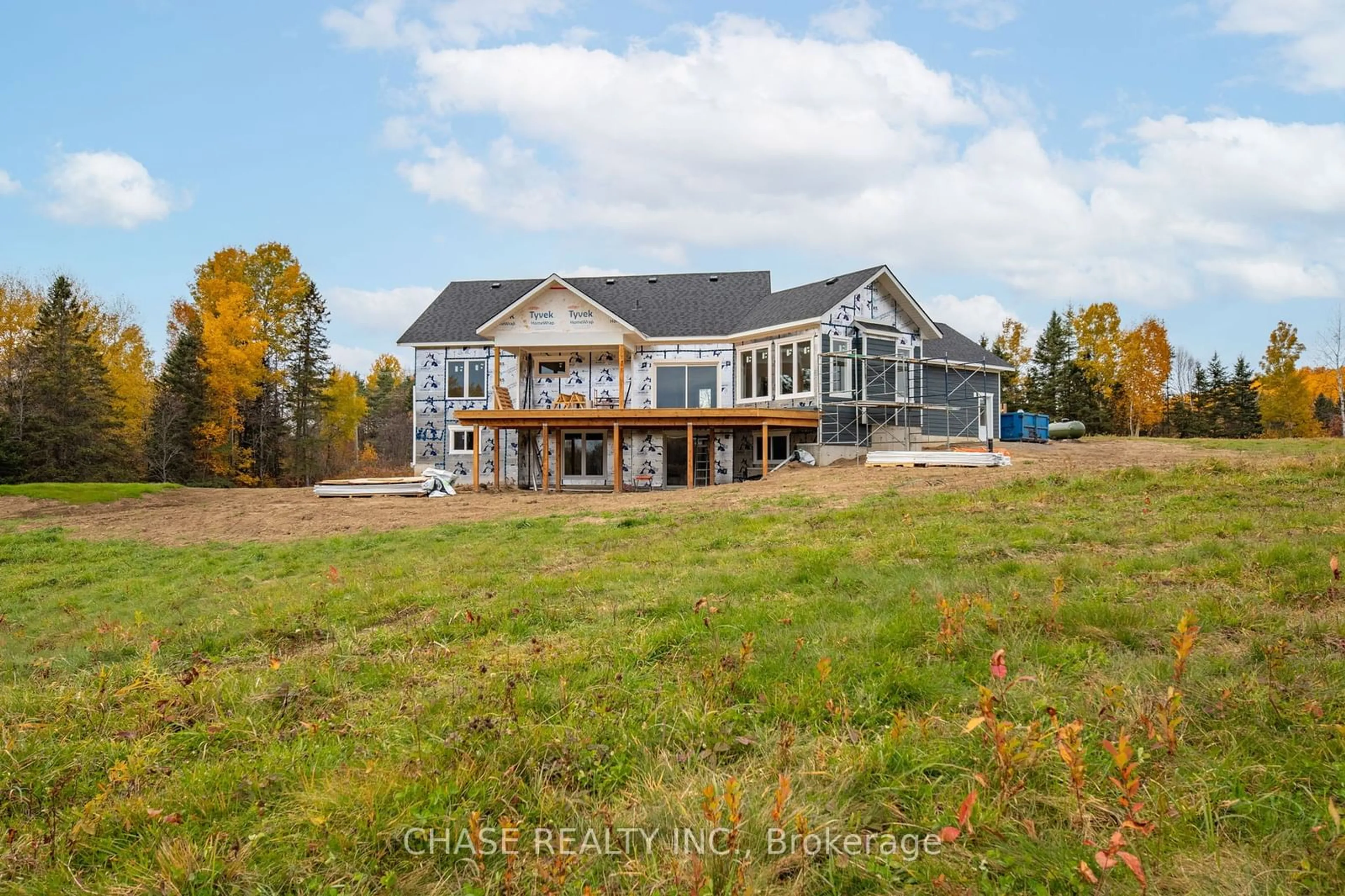 Frontside or backside of a home, the fenced backyard for 141 Three Mile Lake Rd, Armour Ontario P0A 1L0