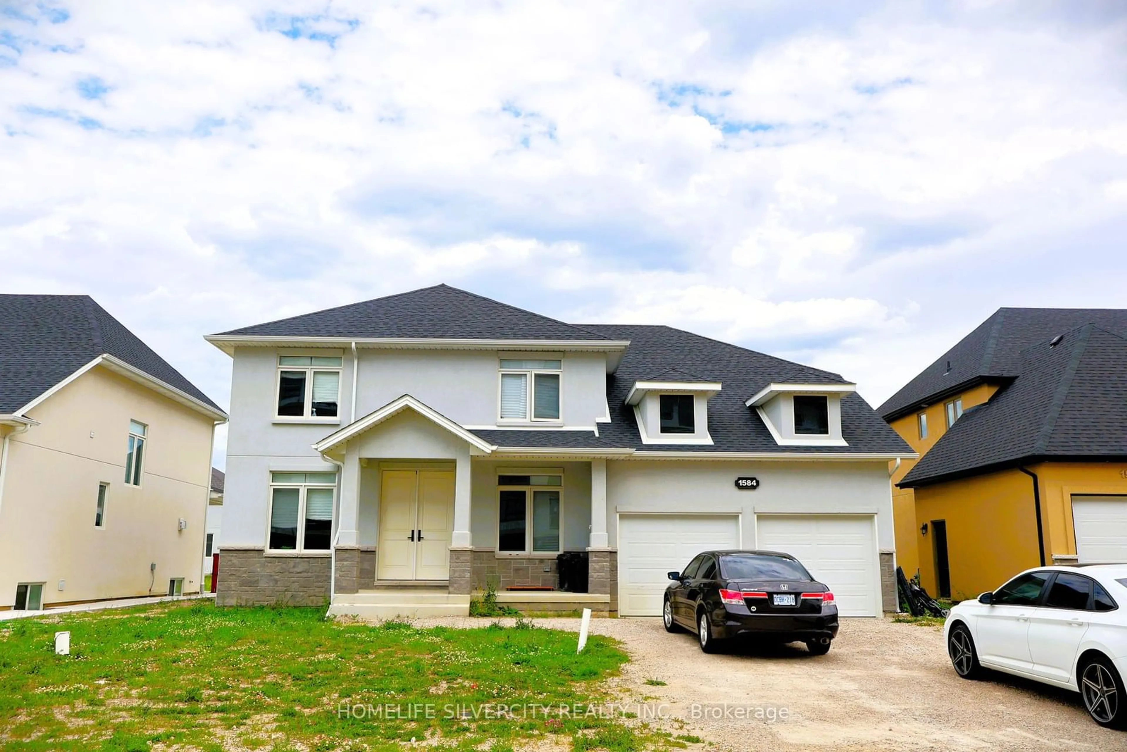 Frontside or backside of a home, the street view for 1584 Bowler Dr, Windsor Ontario N8S 0A9