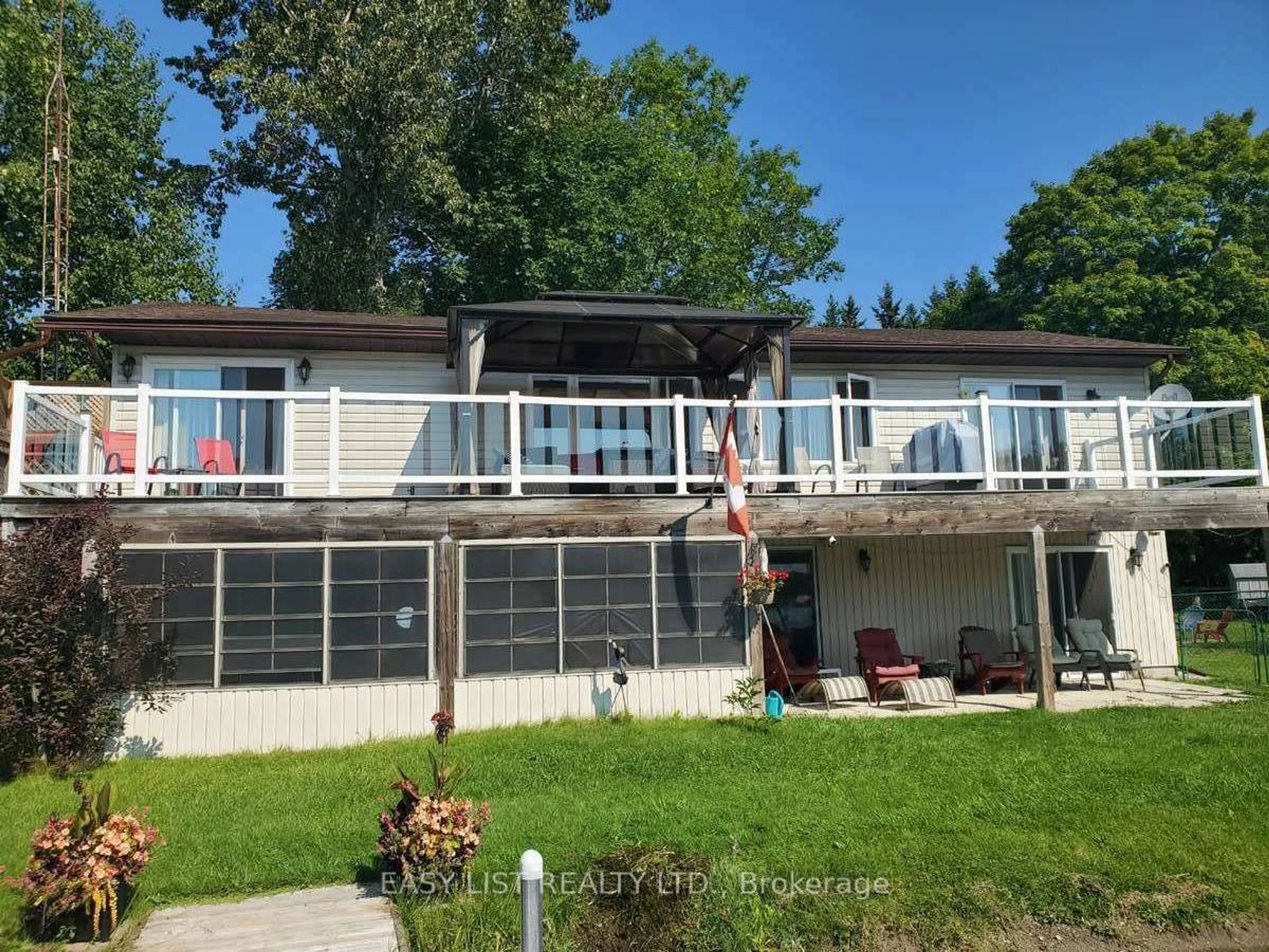 Frontside or backside of a home, the front or back of building for 13 Fire Route 122, Galway-Cavendish and Harvey Ontario K0M 1A0