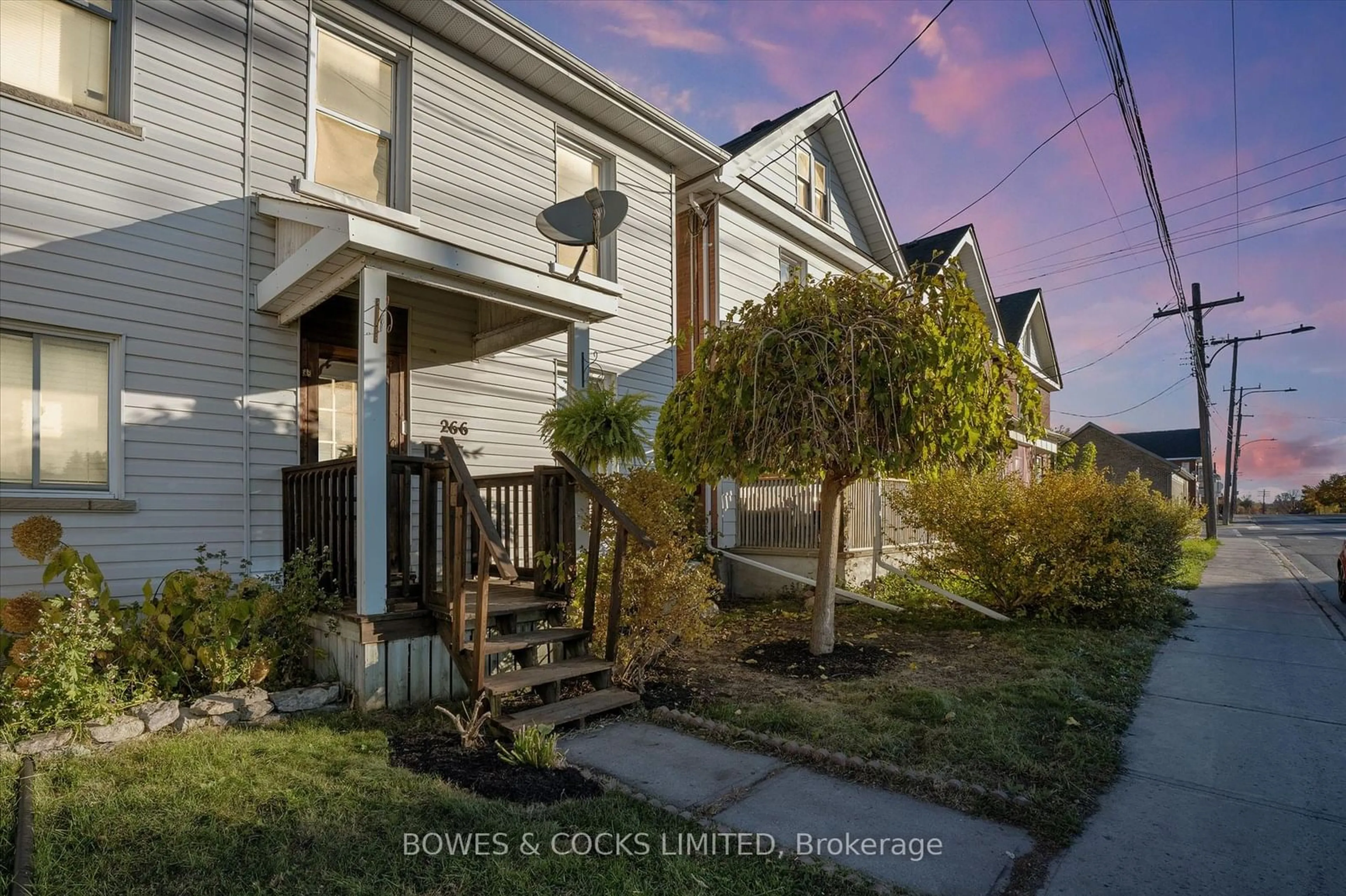 Frontside or backside of a home, the fenced backyard for 266 Wolfe St, Peterborough Ontario K9J 2L3