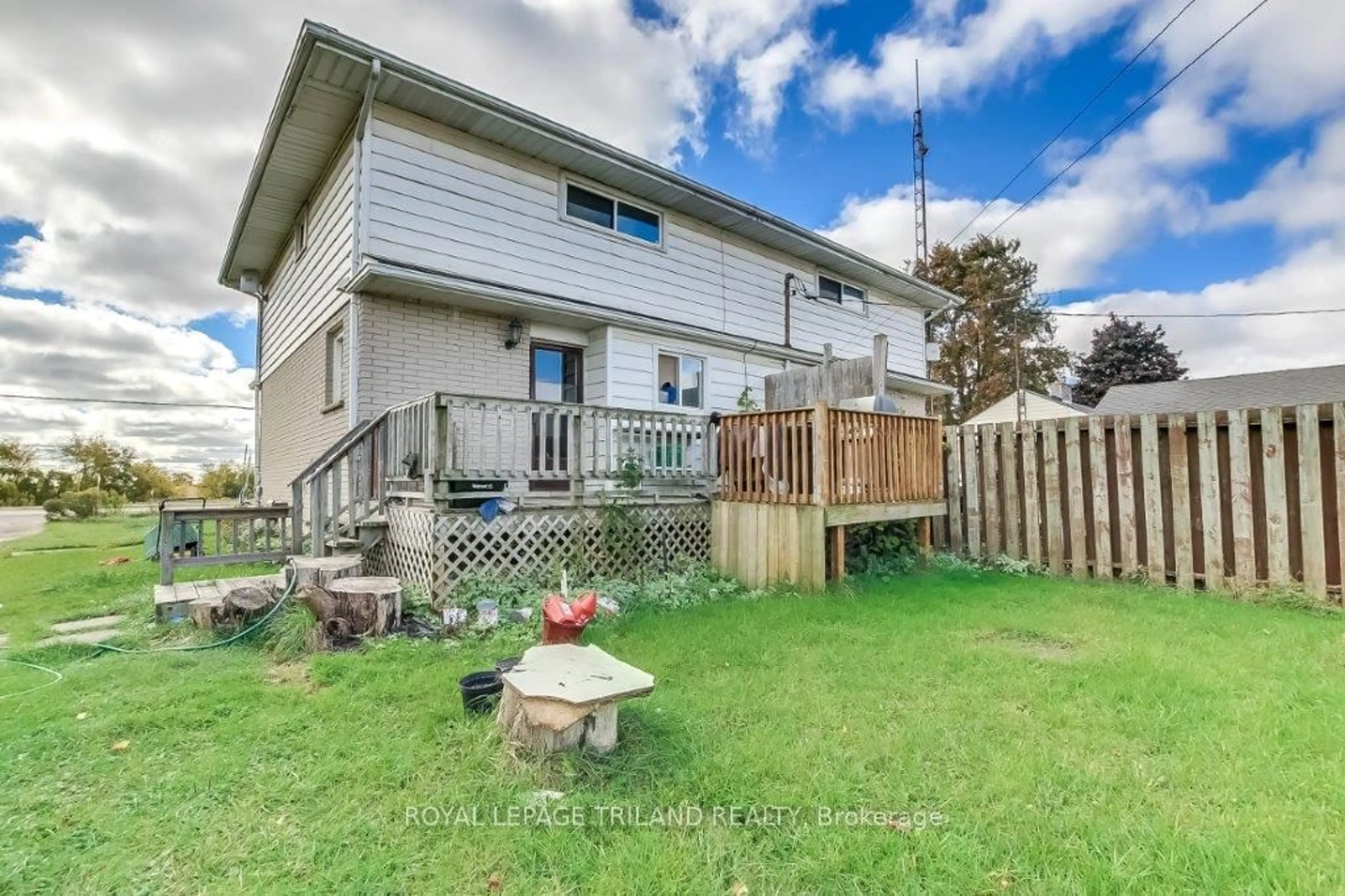 Frontside or backside of a home, the fenced backyard for 685715 Highway 2 Rd, Woodstock Ontario N4S 7V9