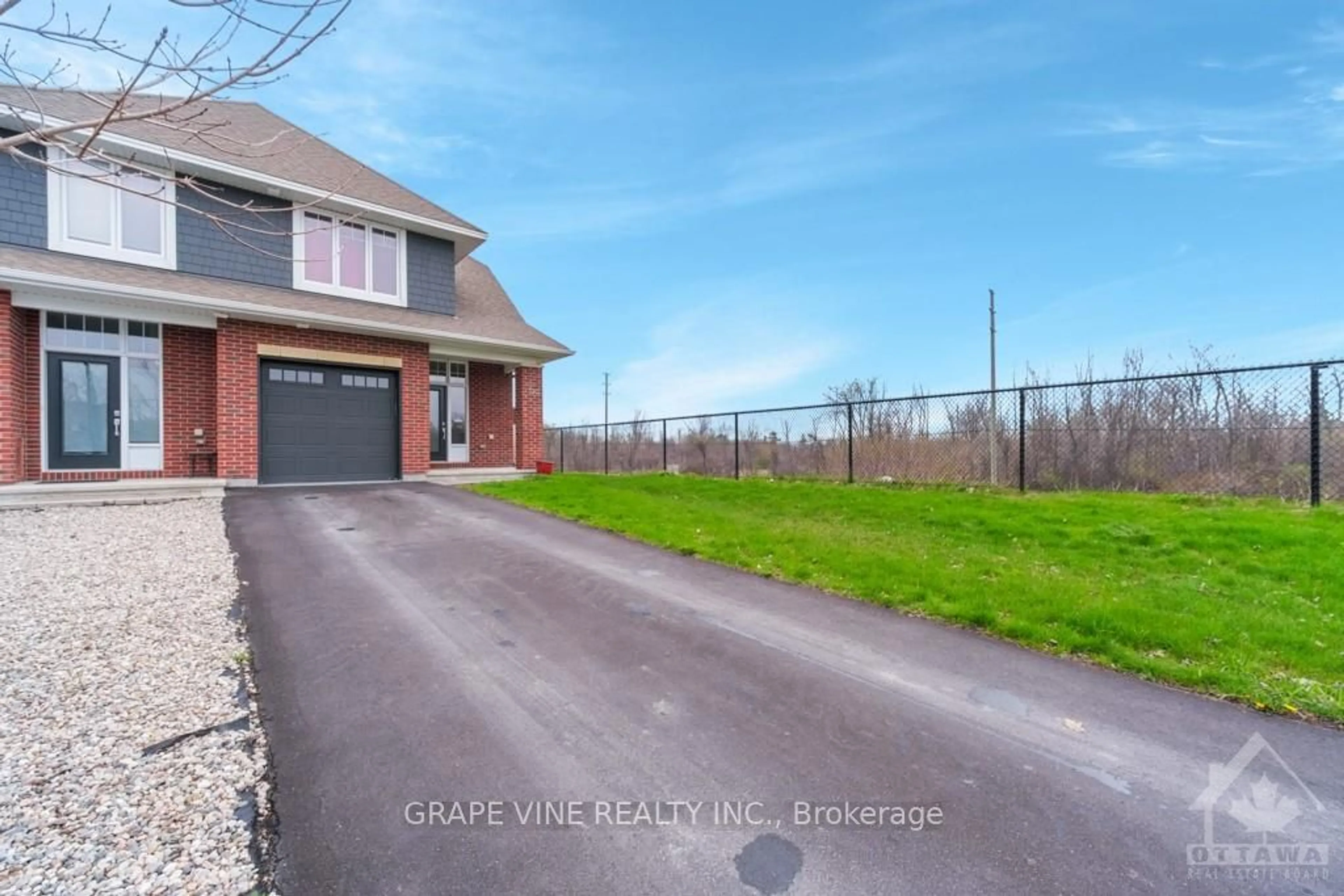 Frontside or backside of a home, the fenced backyard for 320 KILSPINDIE Rdge, Barrhaven Ontario K2J 6A4