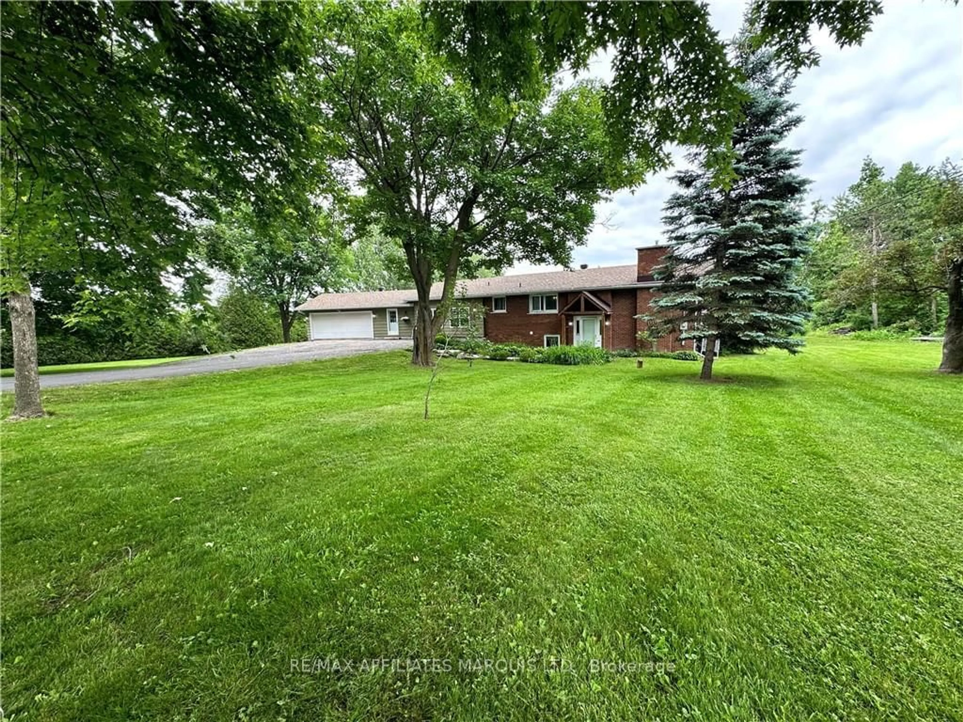 Frontside or backside of a home, the fenced backyard for 18252 COUNTY 19 Rd, South Glengarry Ontario K6K 0A7