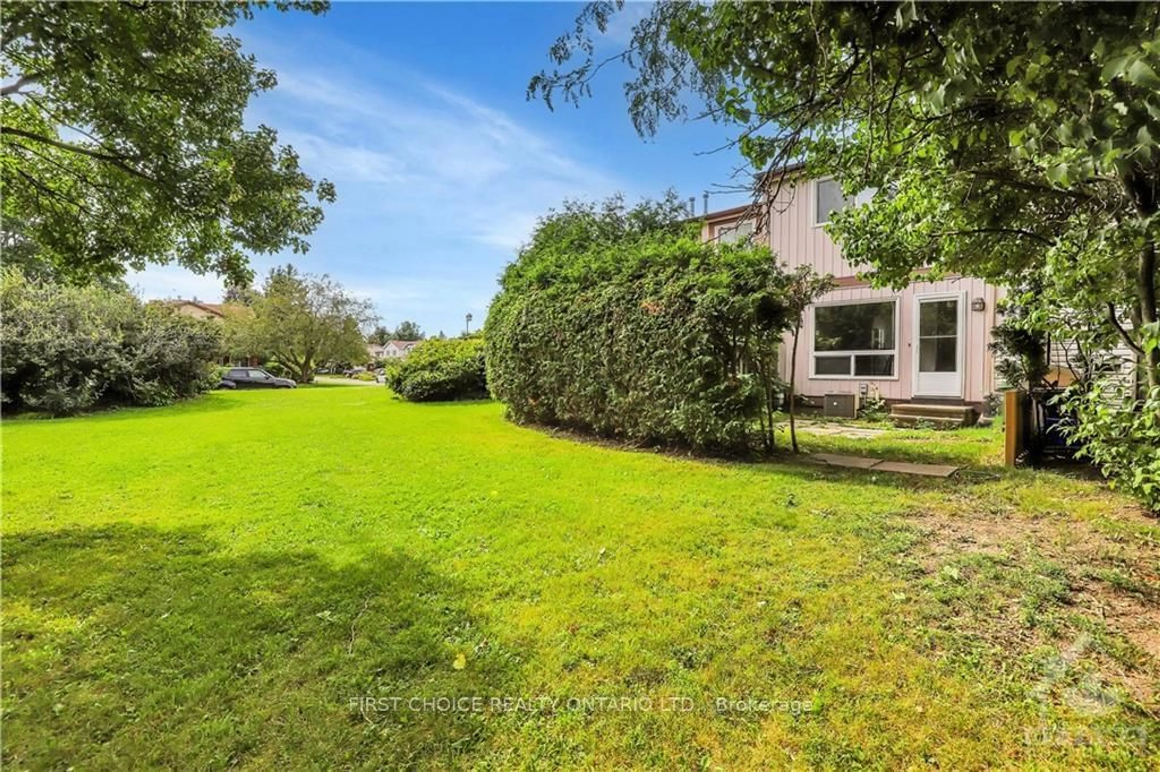 A pic from exterior of the house or condo, the fenced backyard for 18 KNOLLSBROOK Dr #C, Barrhaven Ontario K2J 1K8