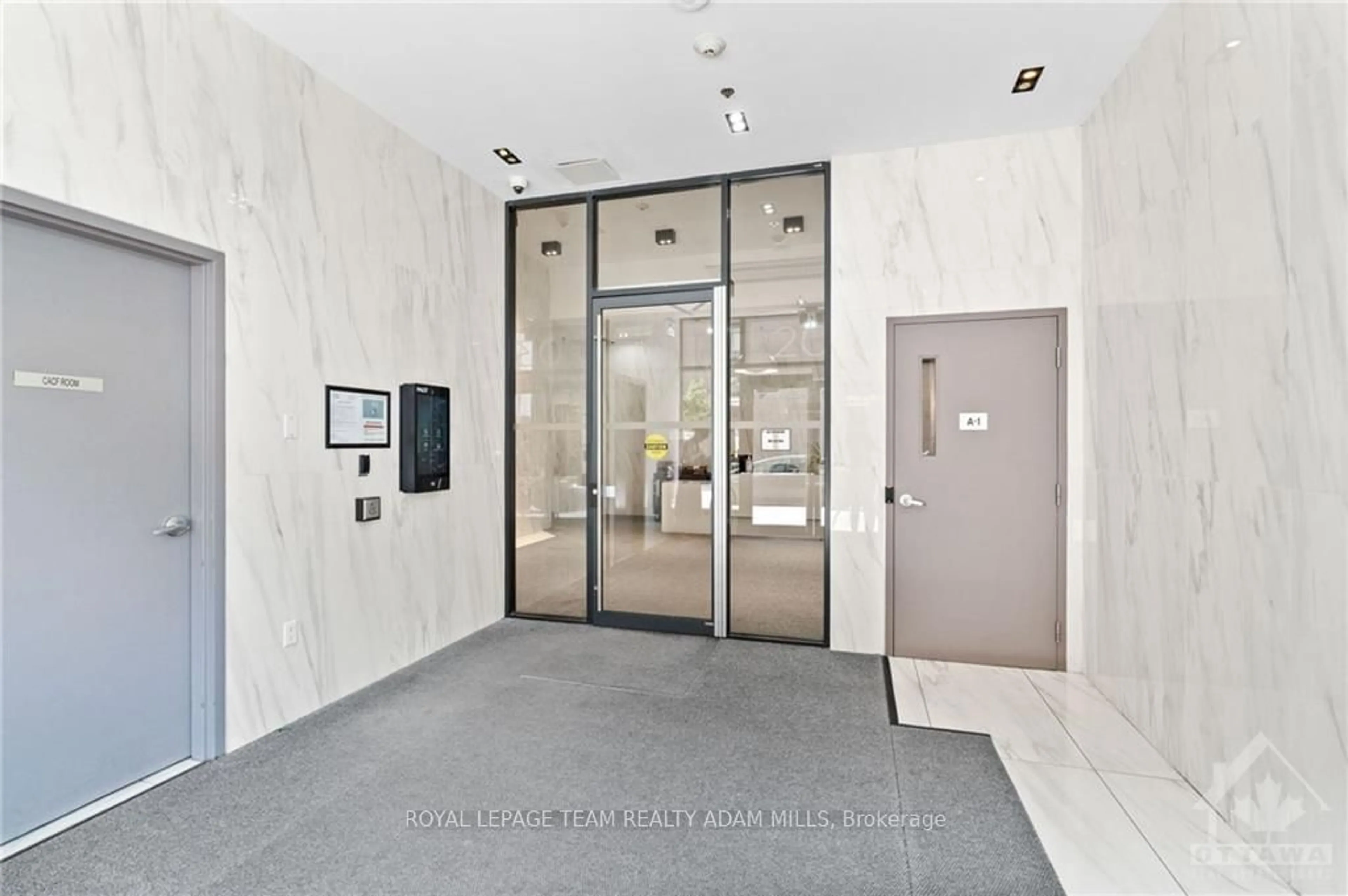 Indoor foyer, cement floor for 203 CATHERINE St #908, Ottawa Centre Ontario K2P 1J5