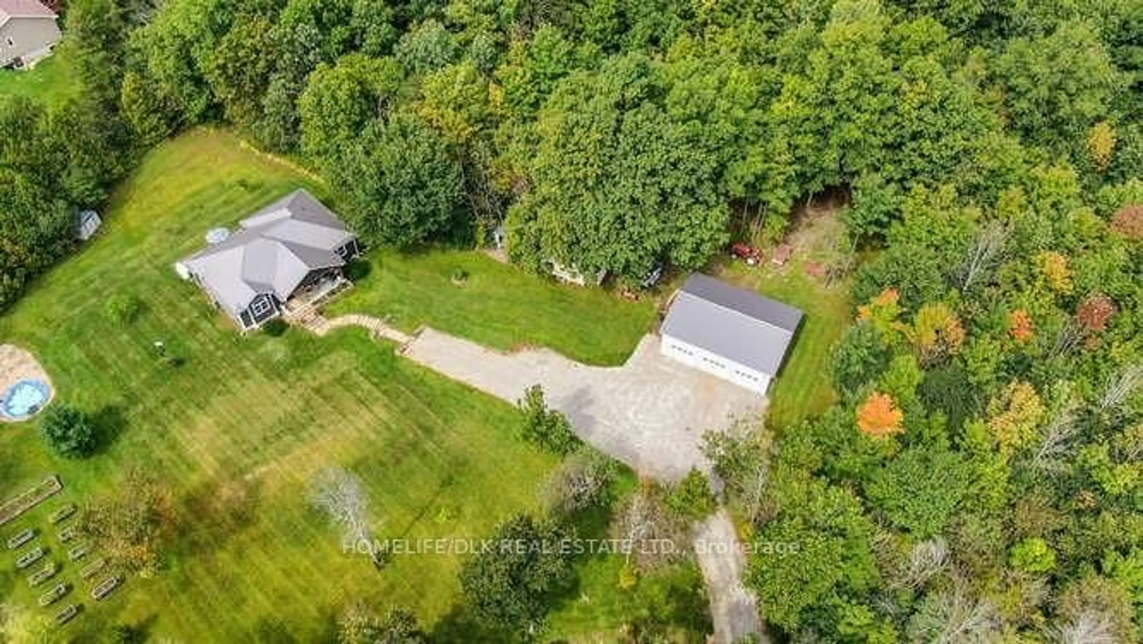 A pic from exterior of the house or condo, the fenced backyard for 1009 HANNA Rd, Rideau Lakes Ontario K0E 1Y0