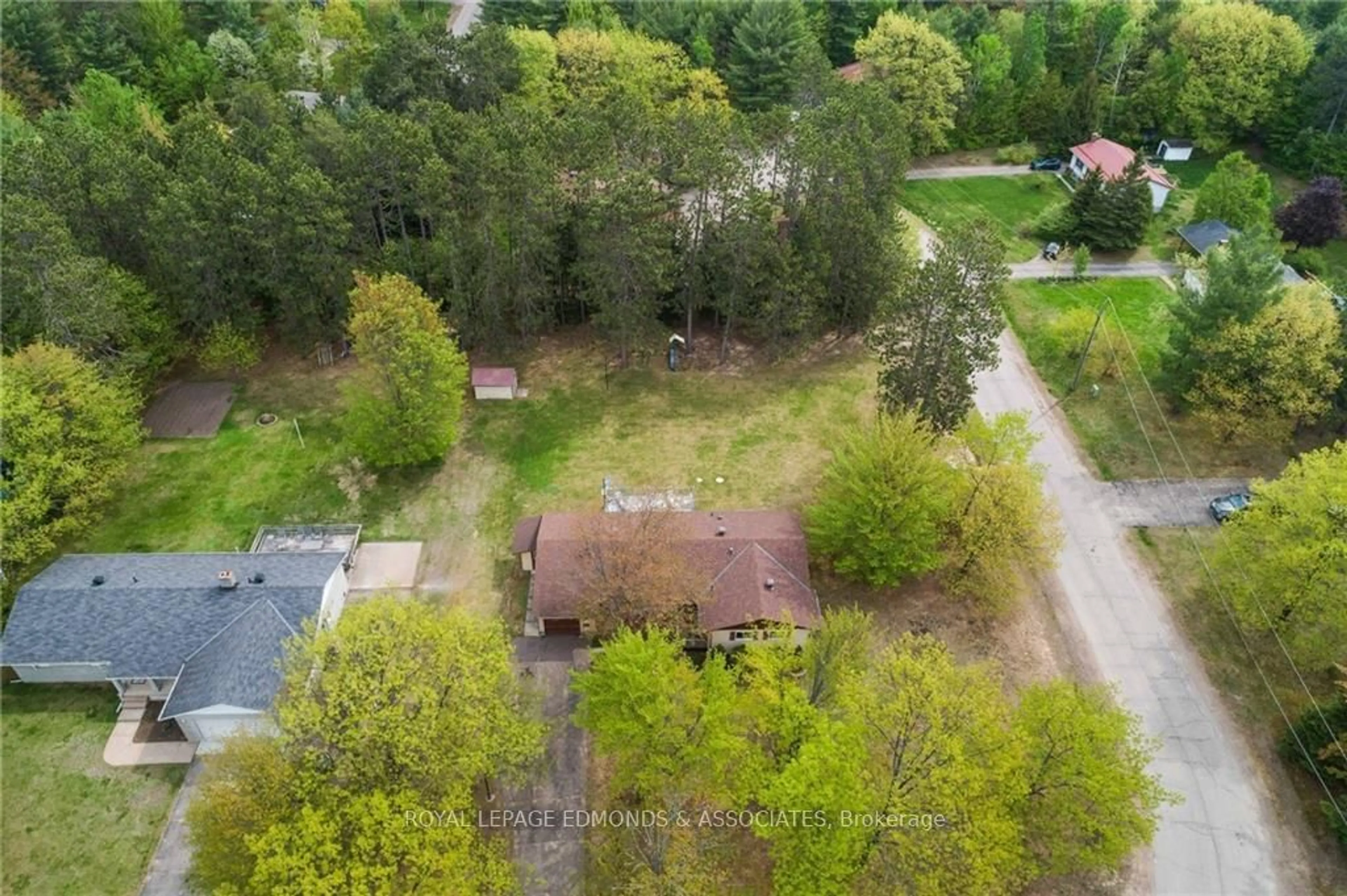 Frontside or backside of a home, the fenced backyard for 10 MCKAY St, Petawawa Ontario K8H 3G8