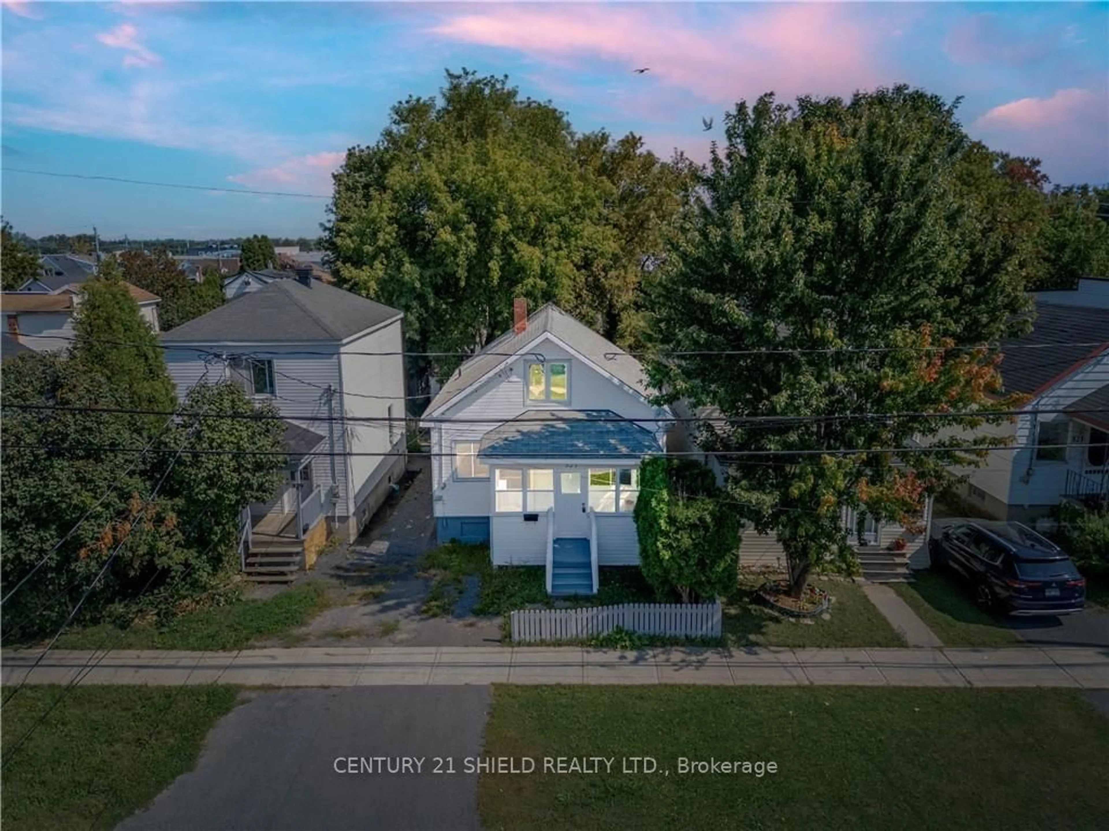 Frontside or backside of a home, the fenced backyard for 327 CARLETON St, Cornwall Ontario K6H 4X6