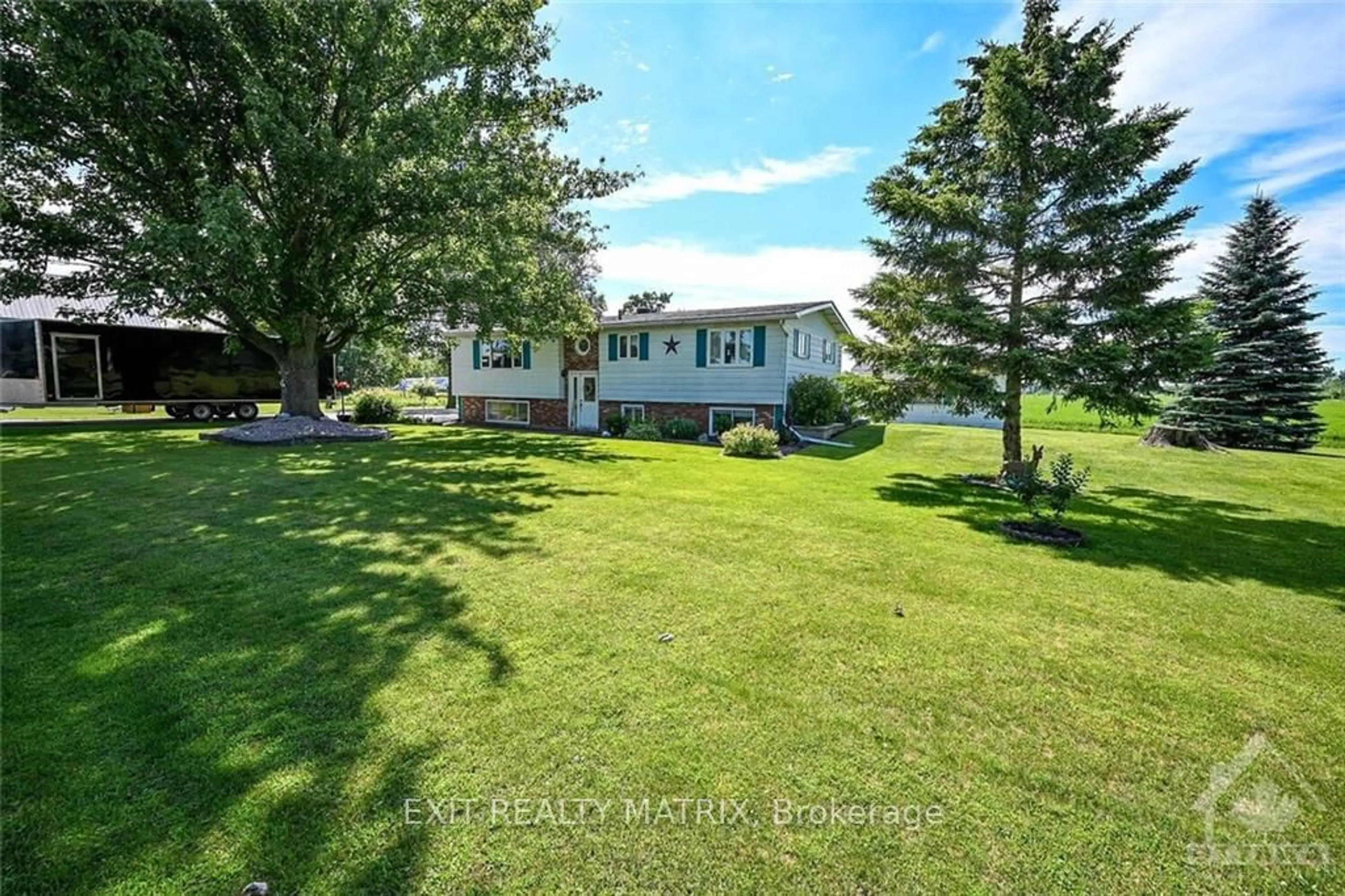 Frontside or backside of a home, the fenced backyard for 12646 COUNTY 28 Rd, South Dundas Ontario K0C 1X0