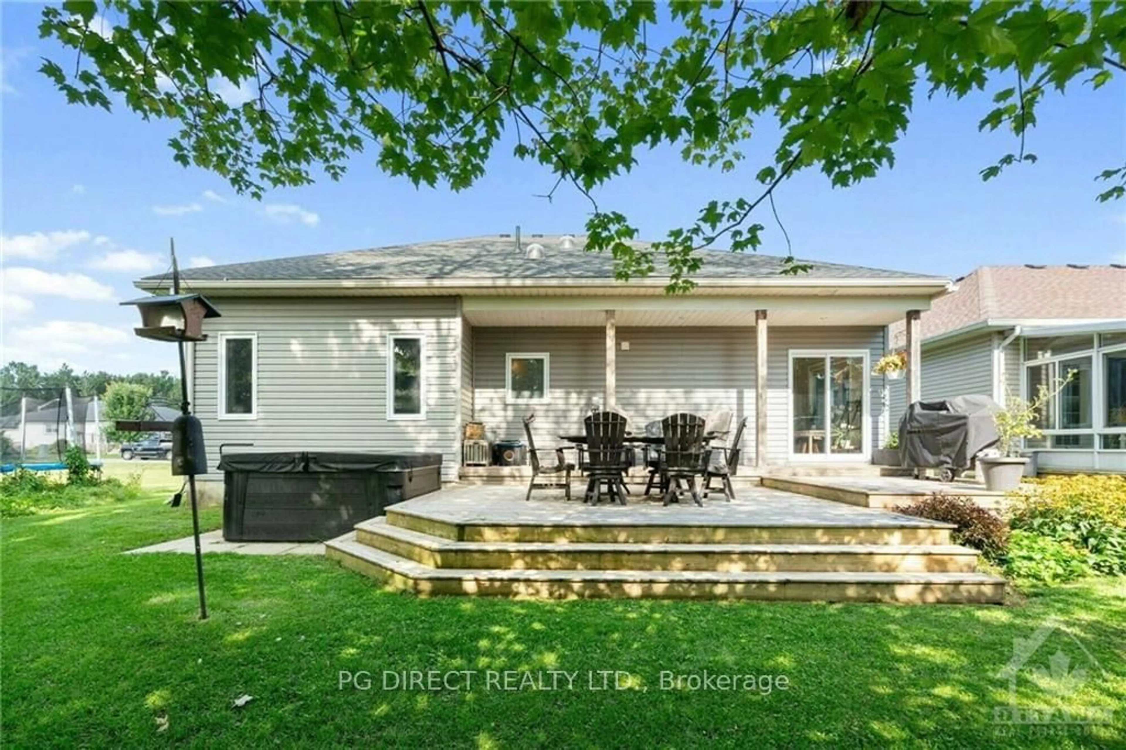 Frontside or backside of a home, the fenced backyard for 1027 MASSIE Dr, Prescott Ontario K0E 1T0