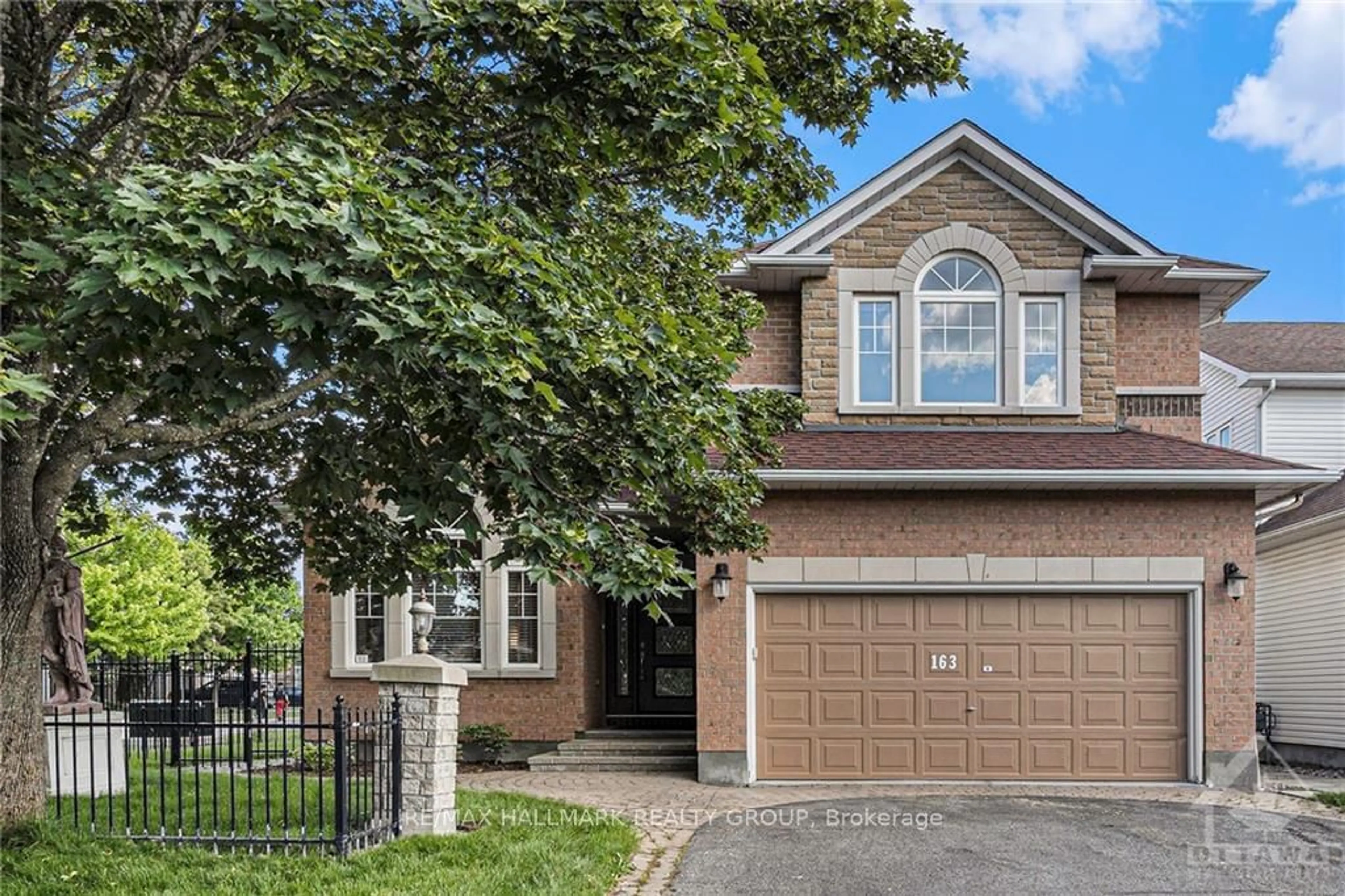 Home with brick exterior material for 163 YOHO Dr, Kanata Ontario K2M 2V4