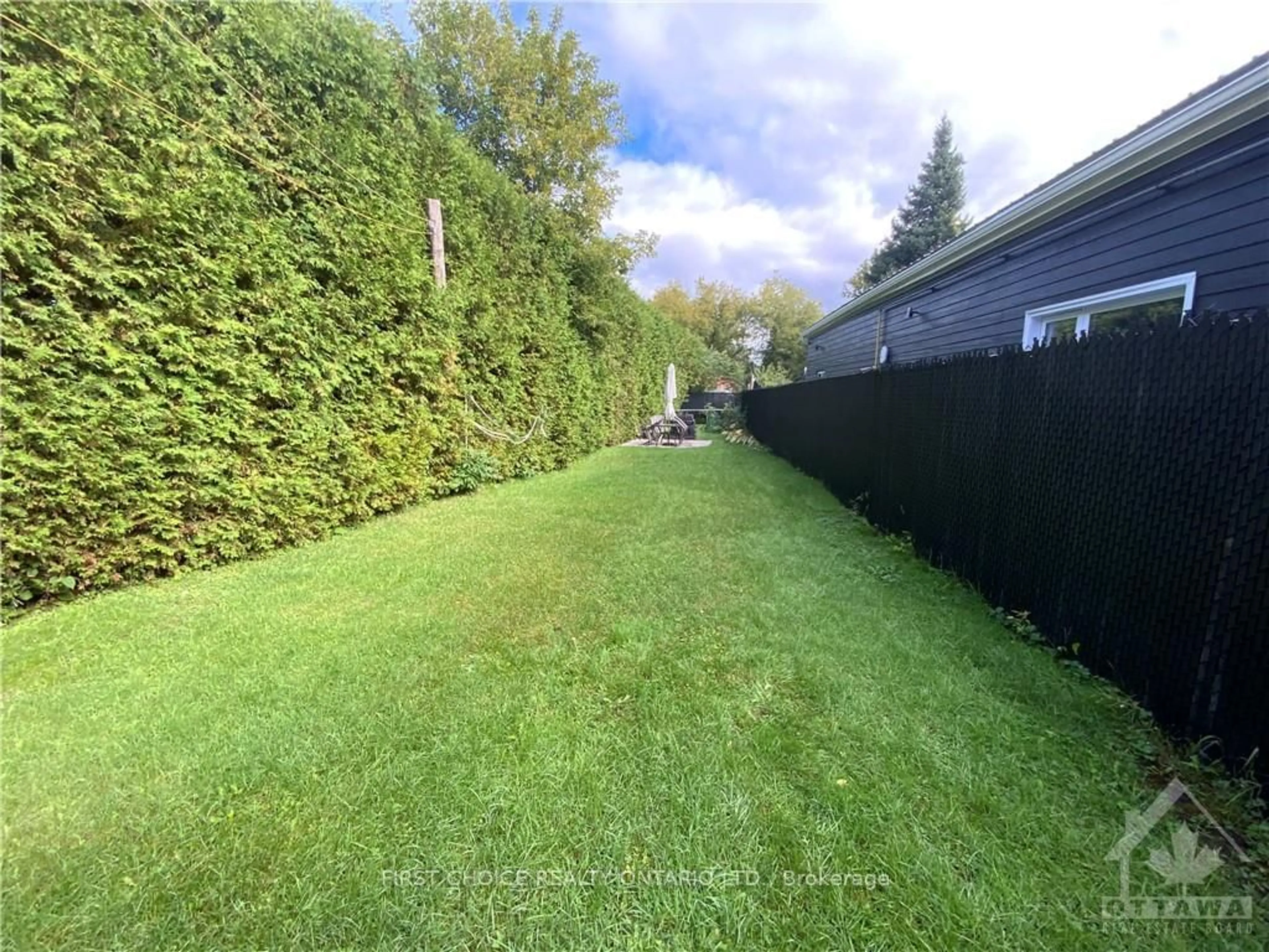 Frontside or backside of a home, the fenced backyard for 735 REGENT St, Hawkesbury Ontario K6A 1G5