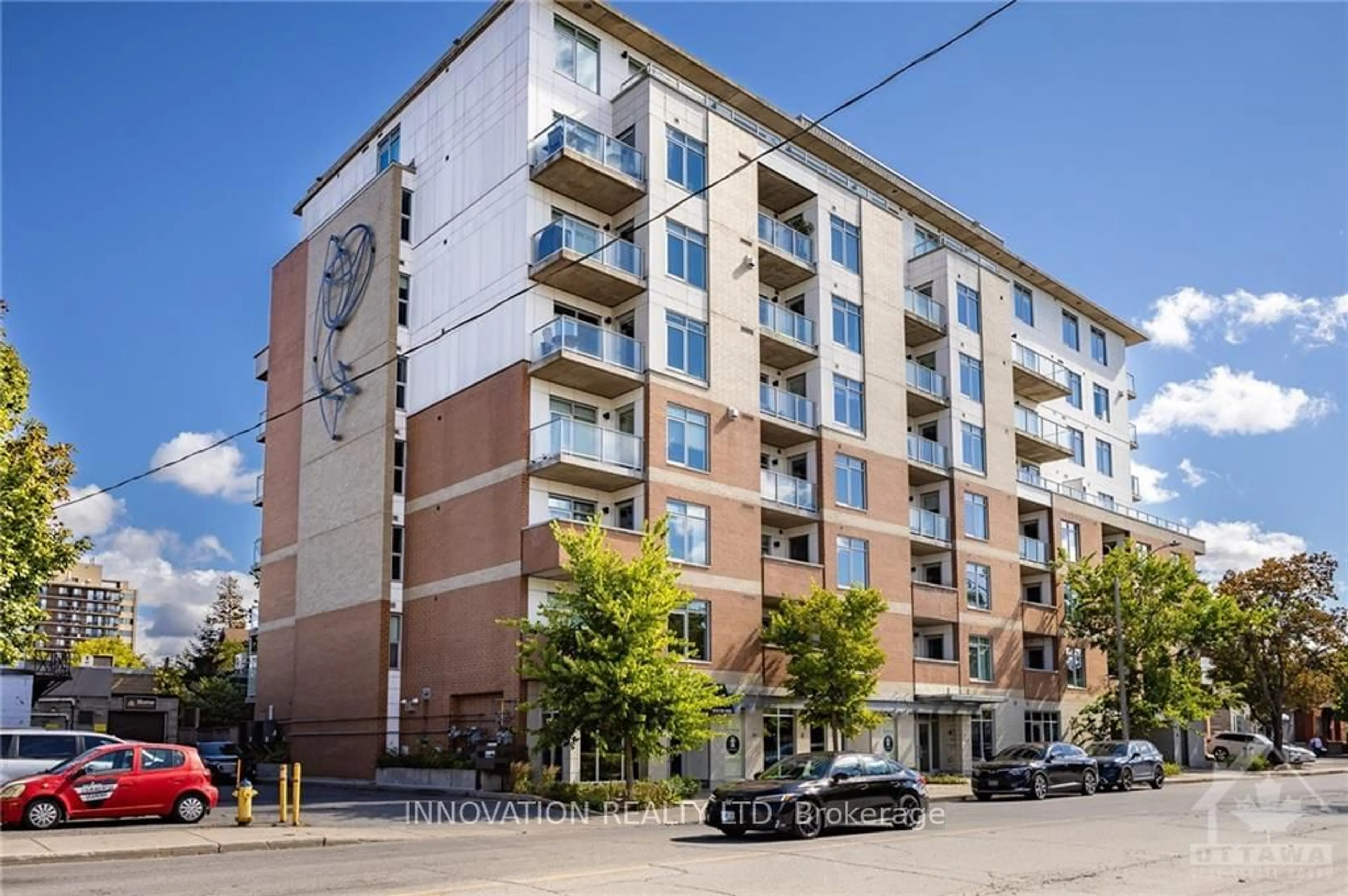 A pic from exterior of the house or condo, the front or back of building for 131 HOLLAND Ave #405, Tunneys Pasture and Ottawa West Ontario K1Y 3A2