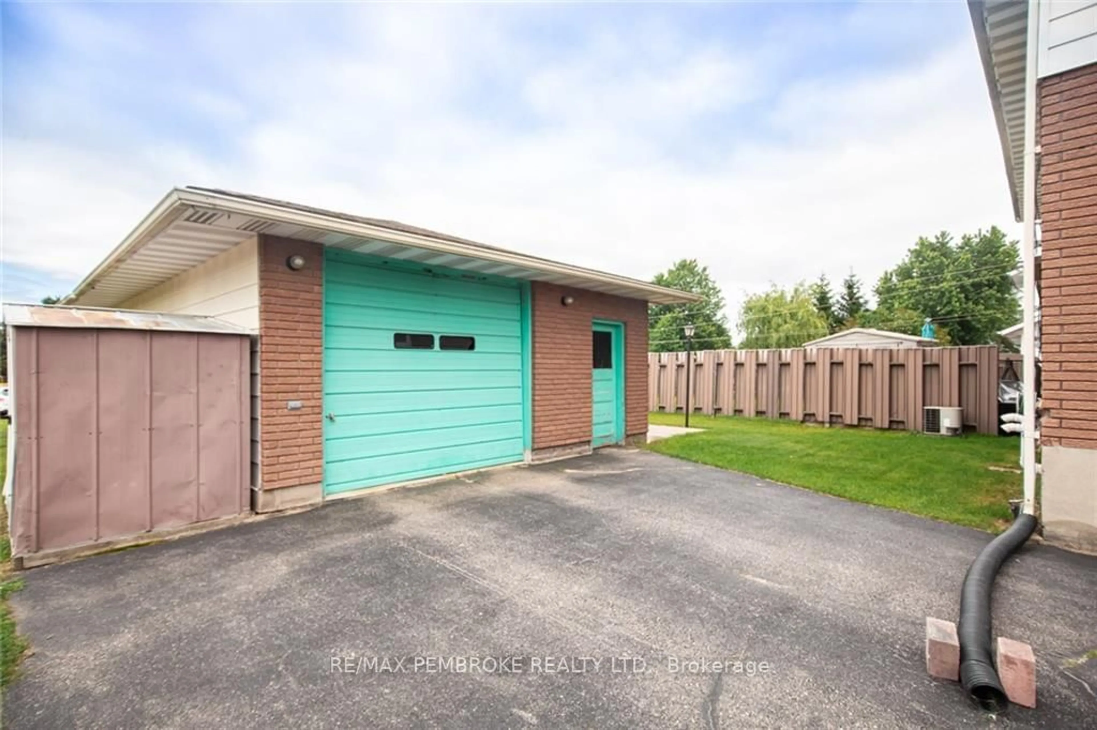 Frontside or backside of a home, the fenced backyard for 20-20A HERMAN St, Petawawa Ontario K8H 1W2