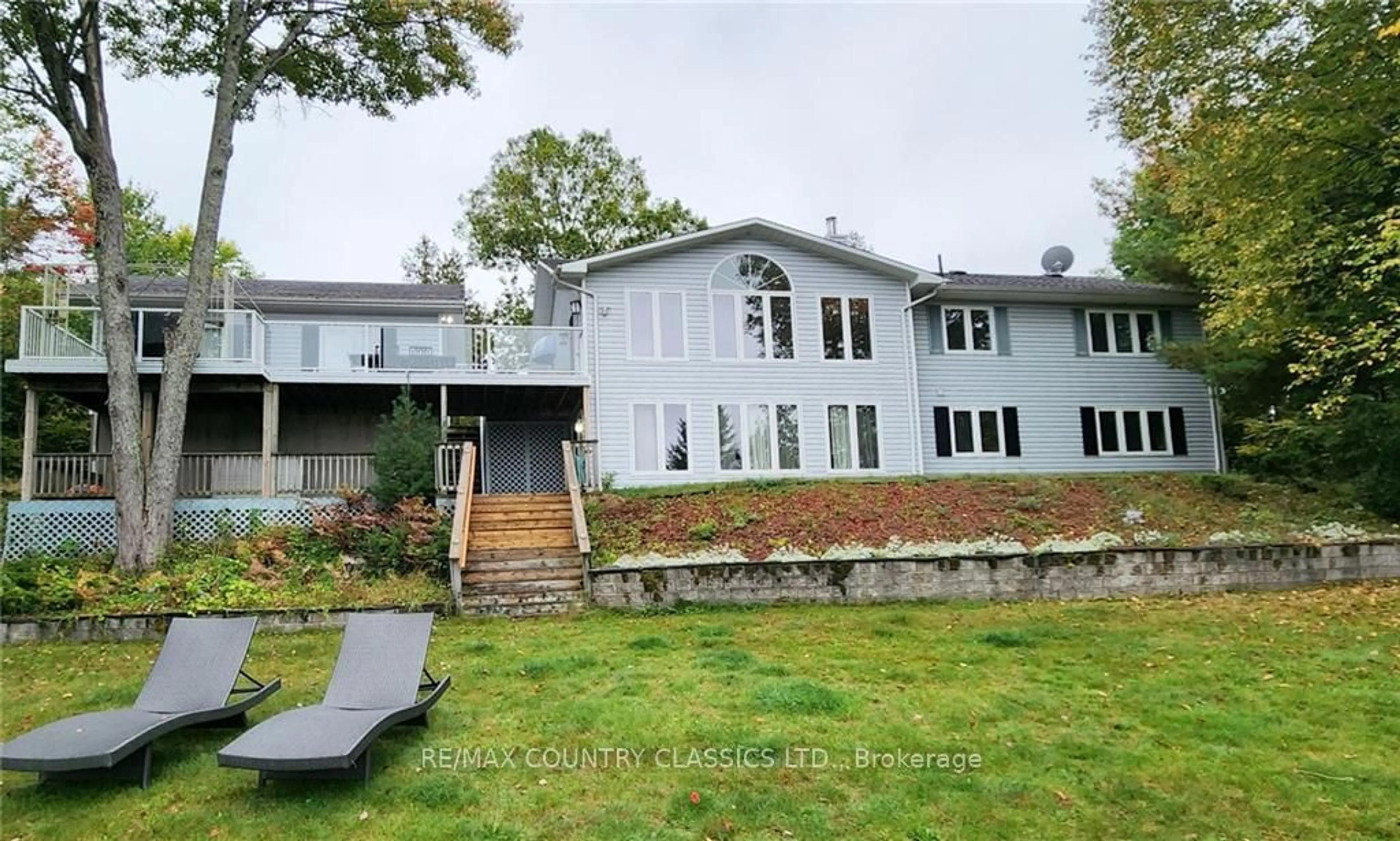 Frontside or backside of a home, the fenced backyard for 112 BAY SHORE Dr, Faraday Ontario K0L 1C0