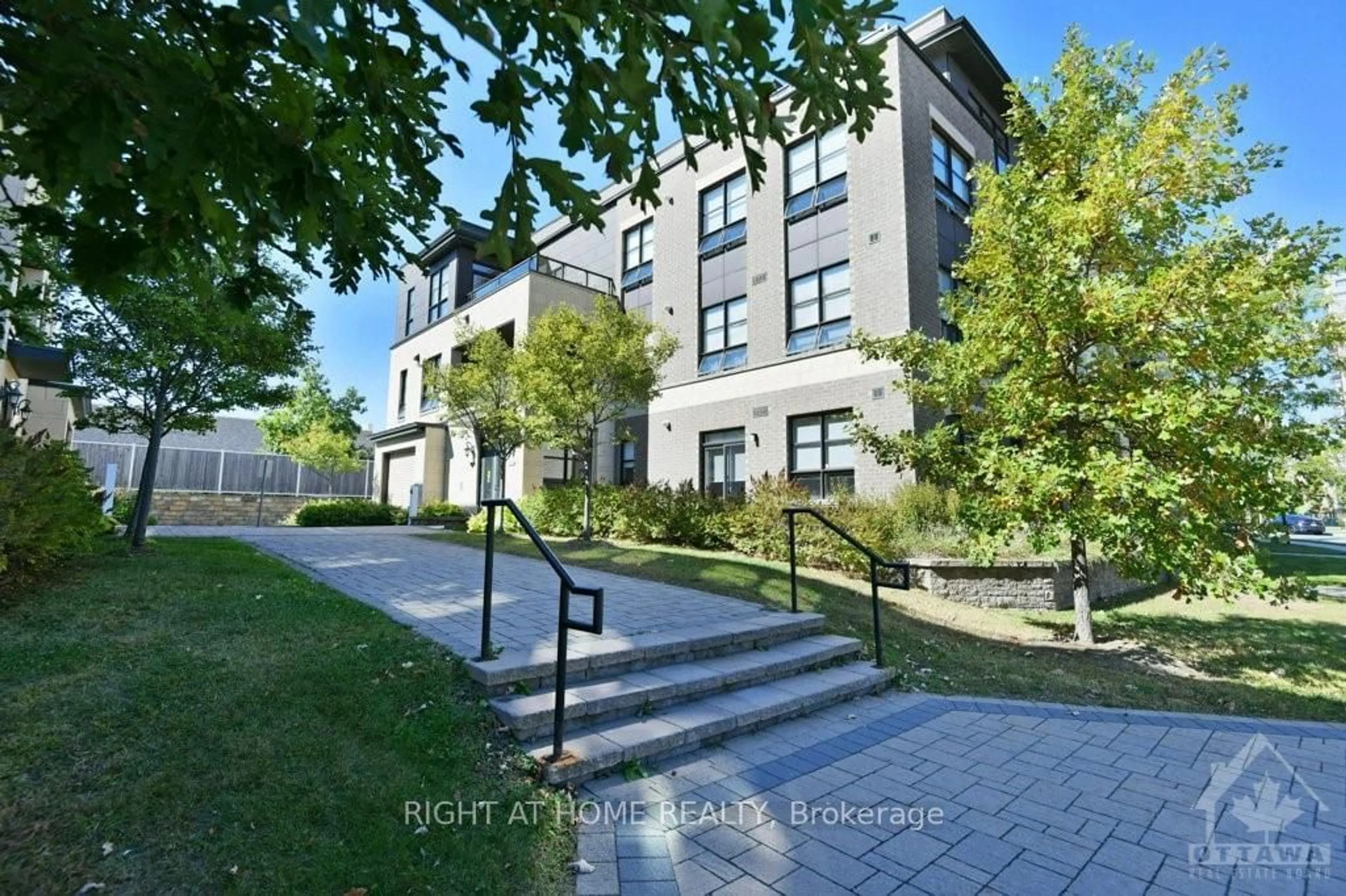 A pic from exterior of the house or condo, the street view for 659 SUE HOLLOWAY Dr #203, Barrhaven Ontario K2J 5W3