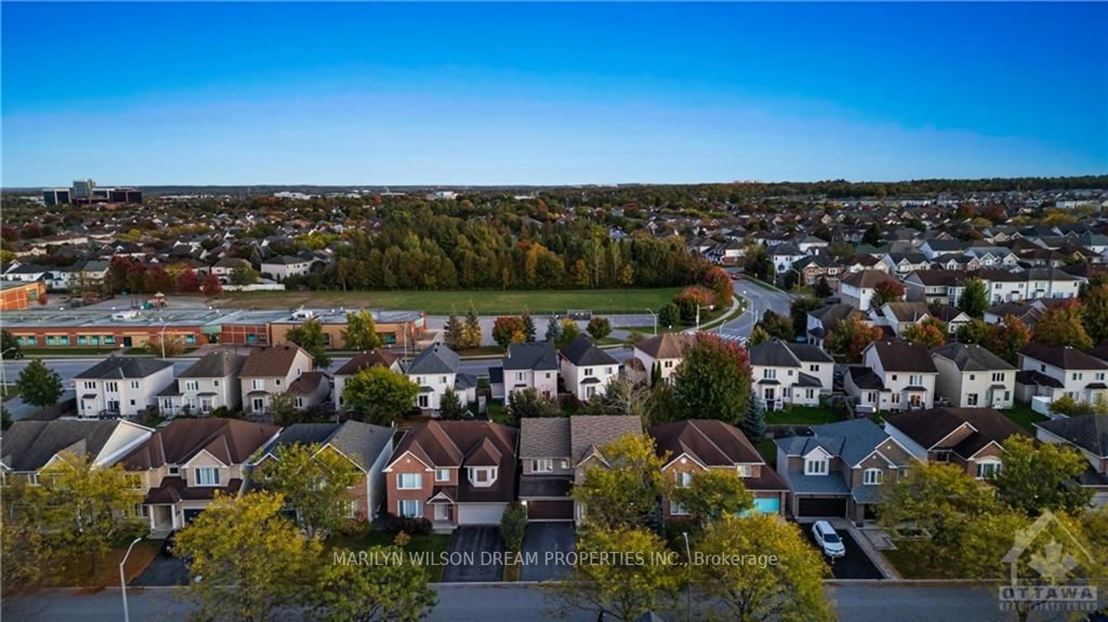 A pic from exterior of the house or condo, the fenced backyard for 325 EDGEMOORE Cres, Kanata Ontario K2W 1H9