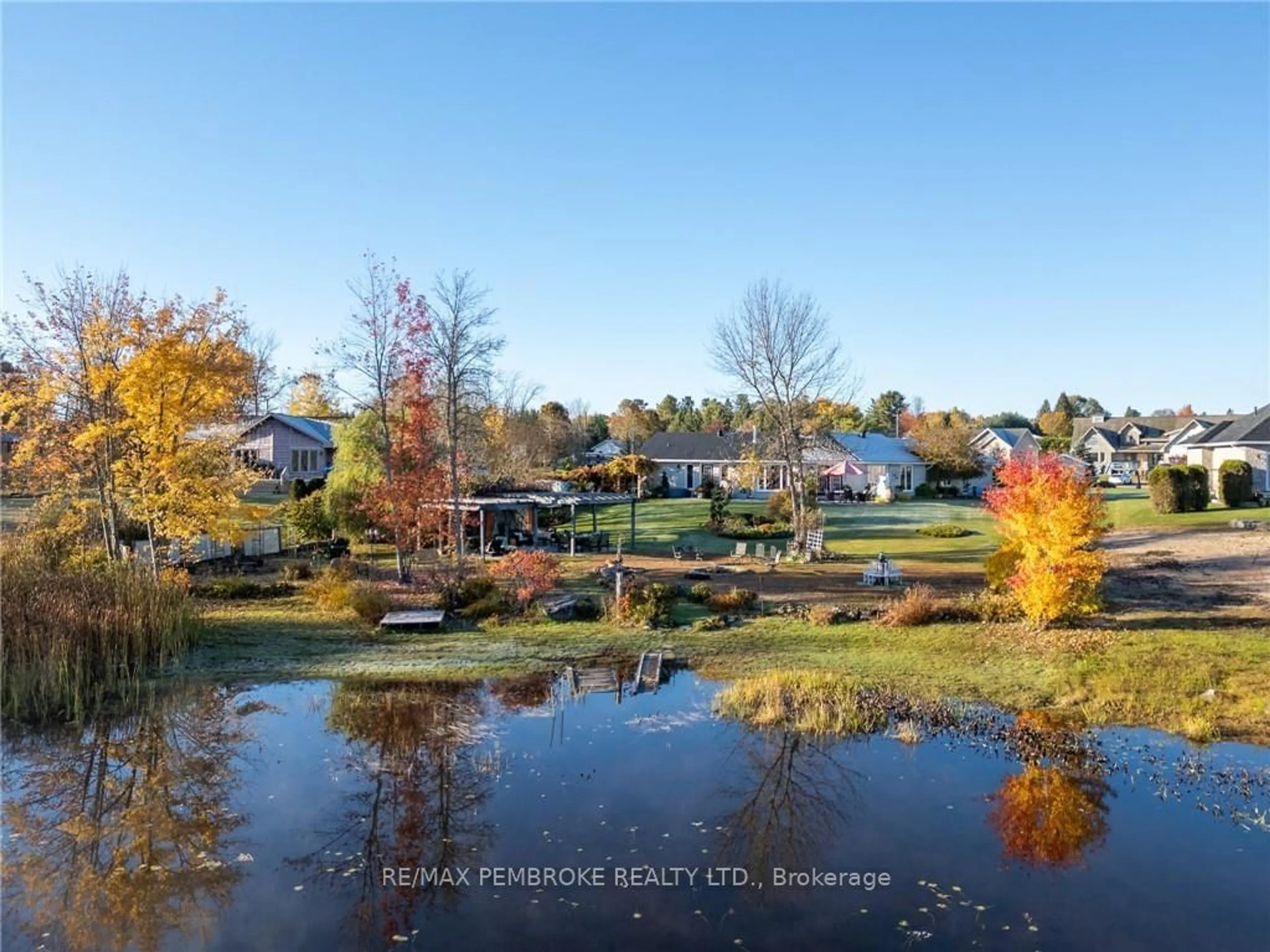 A pic from exterior of the house or condo, the fenced backyard for 11 FAIRWAY Dr, Petawawa Ontario K8A 8N2