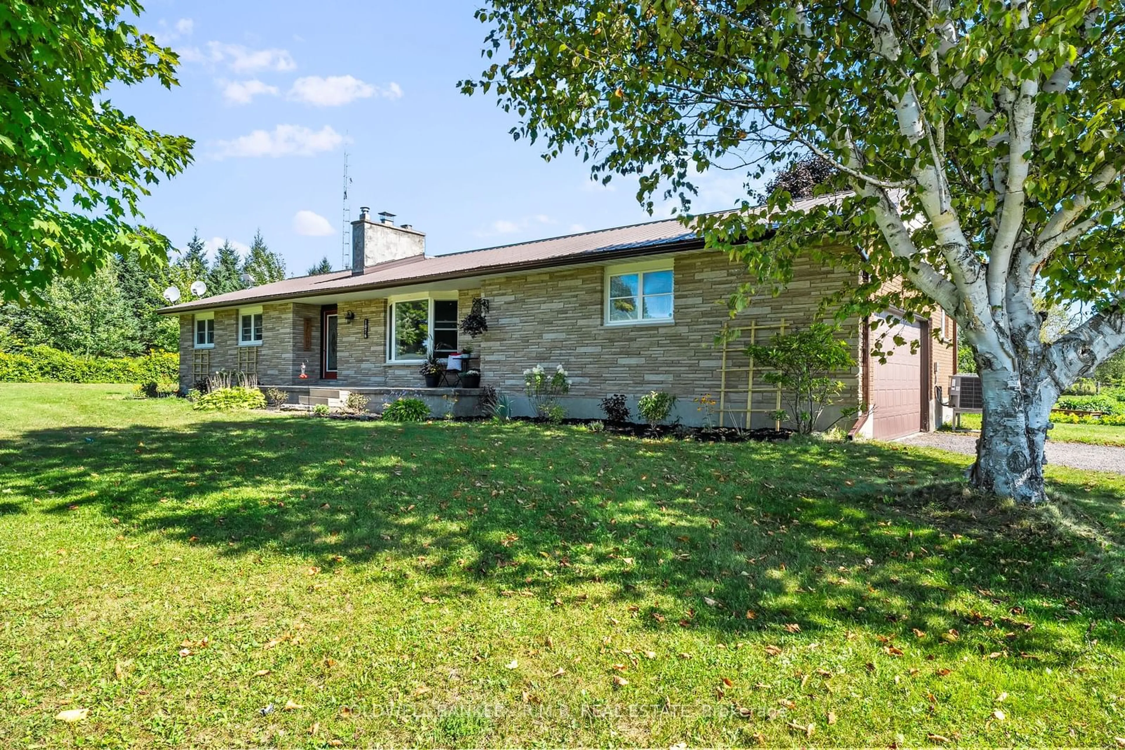 Frontside or backside of a home, the fenced backyard for 1076 Sandringham Rd, Kawartha Lakes Ontario K0M 2T0