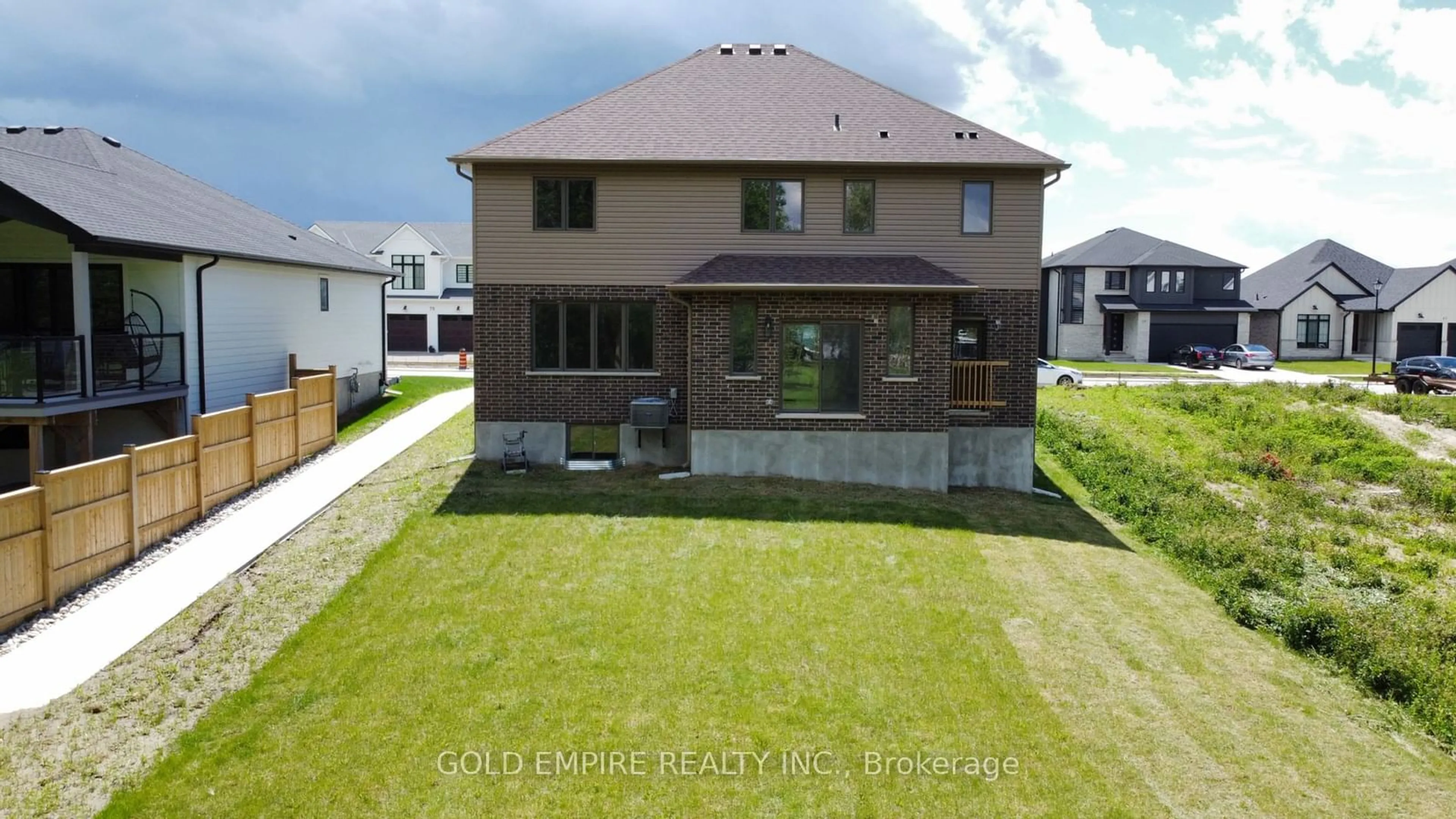 Frontside or backside of a home, the fenced backyard for 74 Royal Cres, Southwold Ontario N5P 3T2