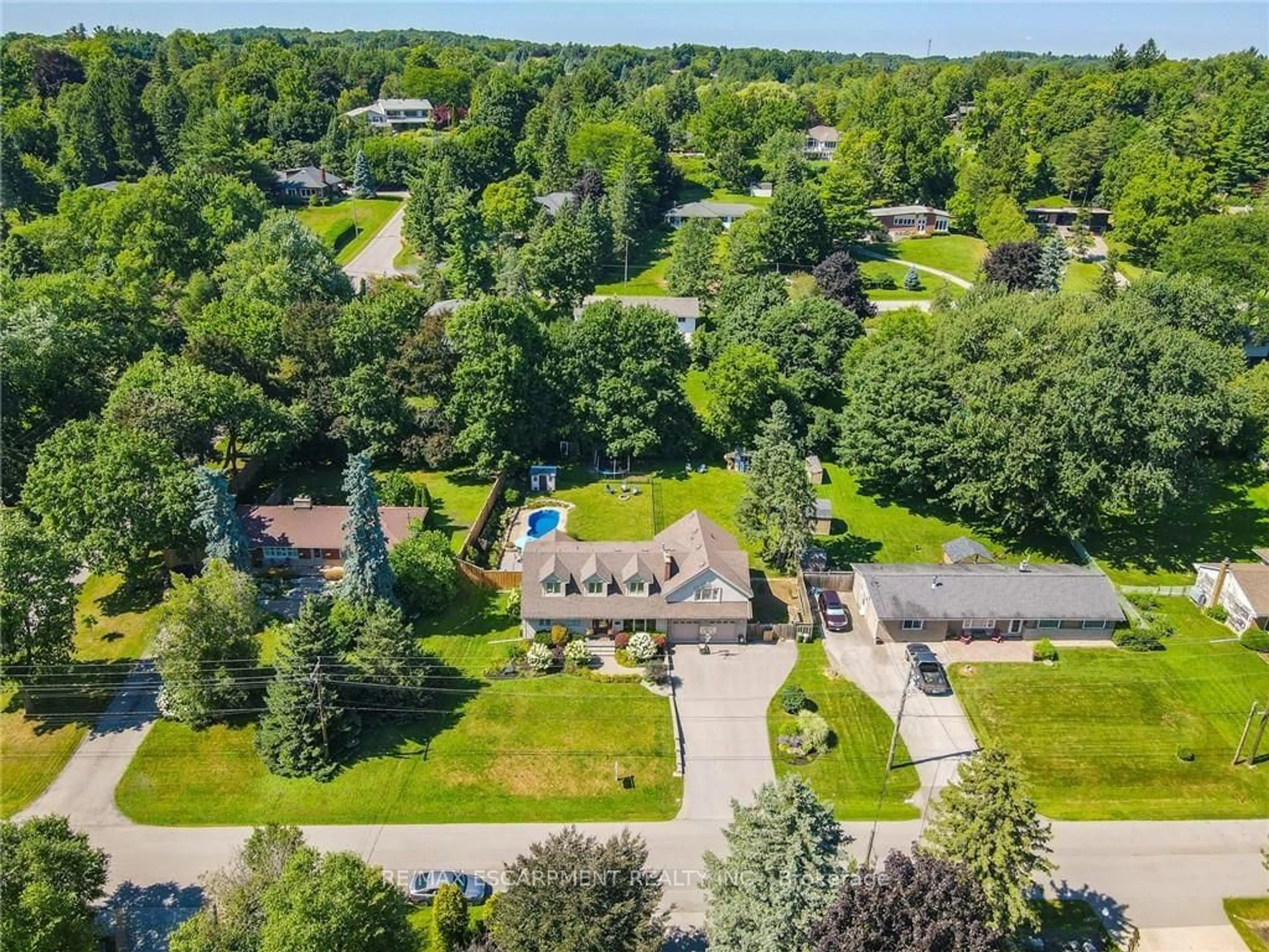 Frontside or backside of a home, the fenced backyard for 37 Maple Ave, Hamilton Ontario L9H 4W5