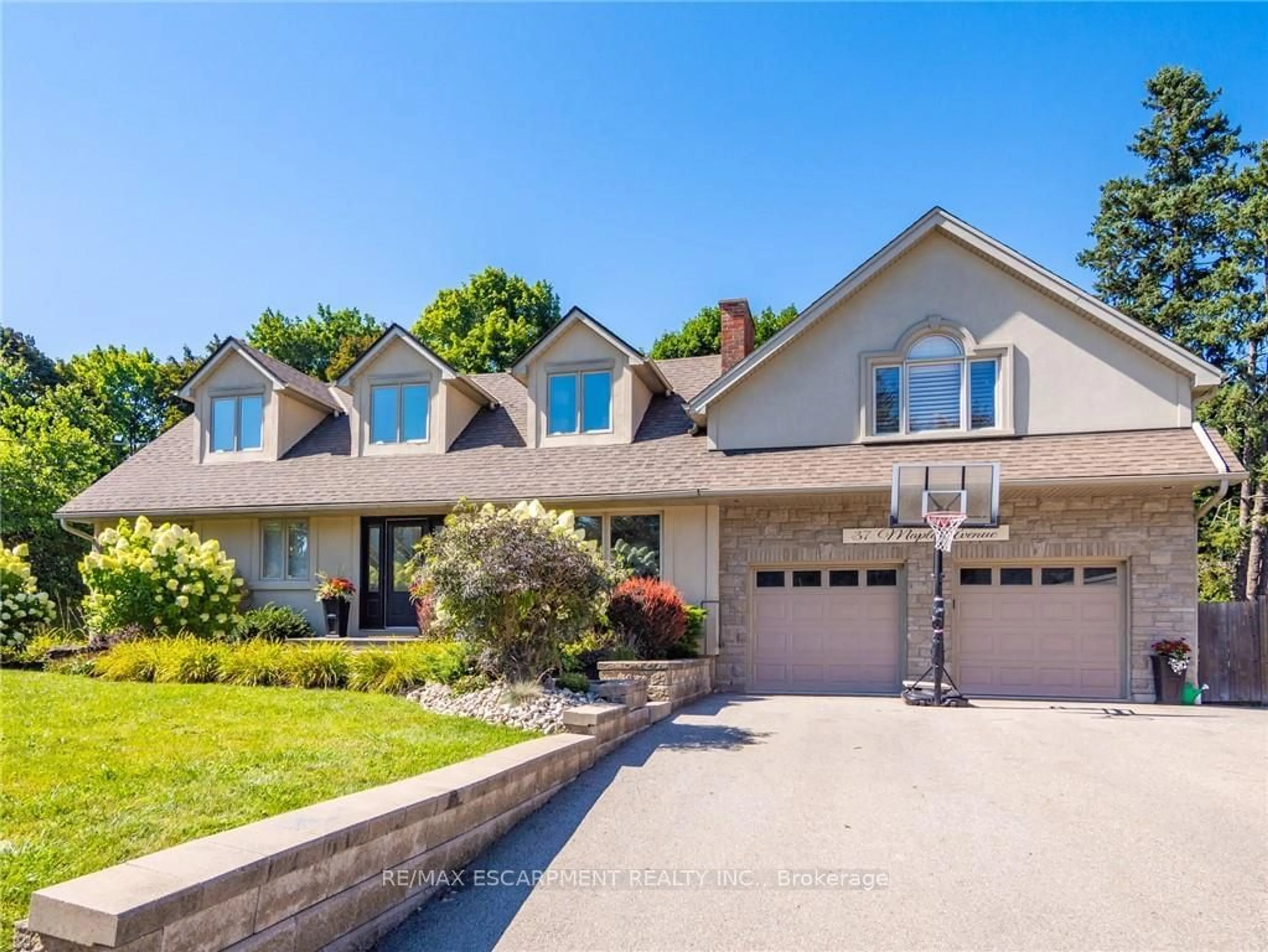 Frontside or backside of a home, the street view for 37 Maple Ave, Hamilton Ontario L9H 4W5