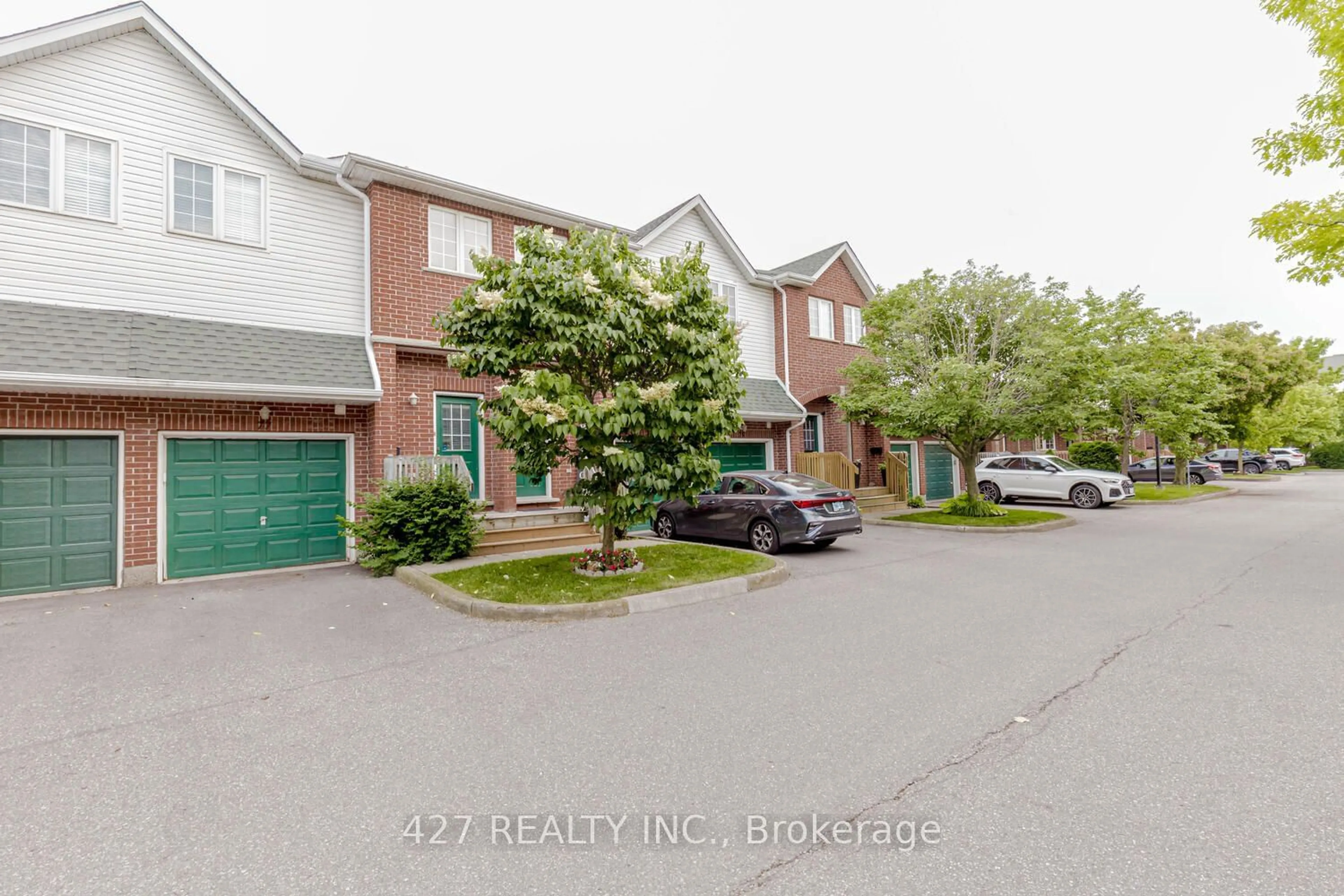 A pic from exterior of the house or condo, the street view for 42 Green Valley Dr #77, Kitchener Ontario N2P 2J8