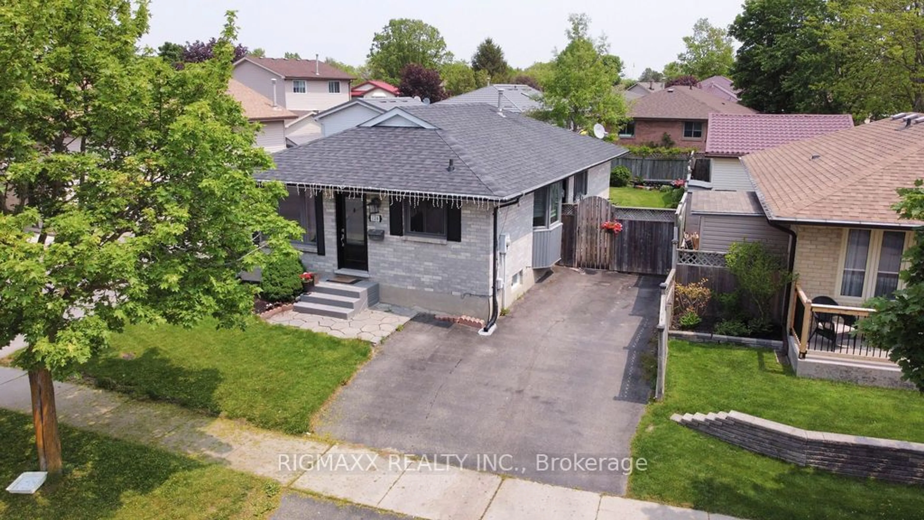 Frontside or backside of a home, the fenced backyard for 126 Carlyle Dr, London Ontario N5V 3T1