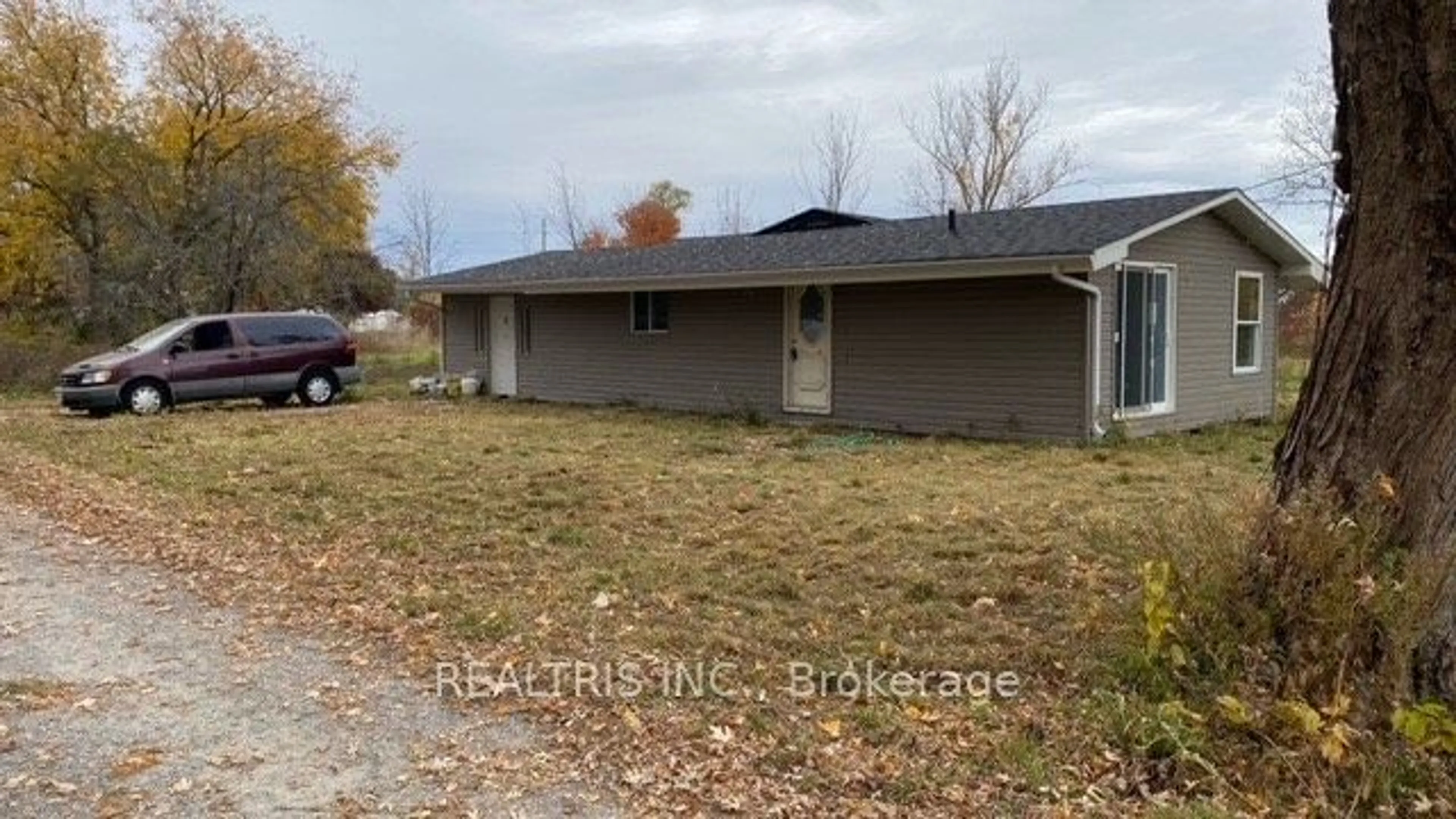 Frontside or backside of a home, the fenced backyard for 22499 Loyalist Pkwy, Trent Hills Ontario K8N 5P7