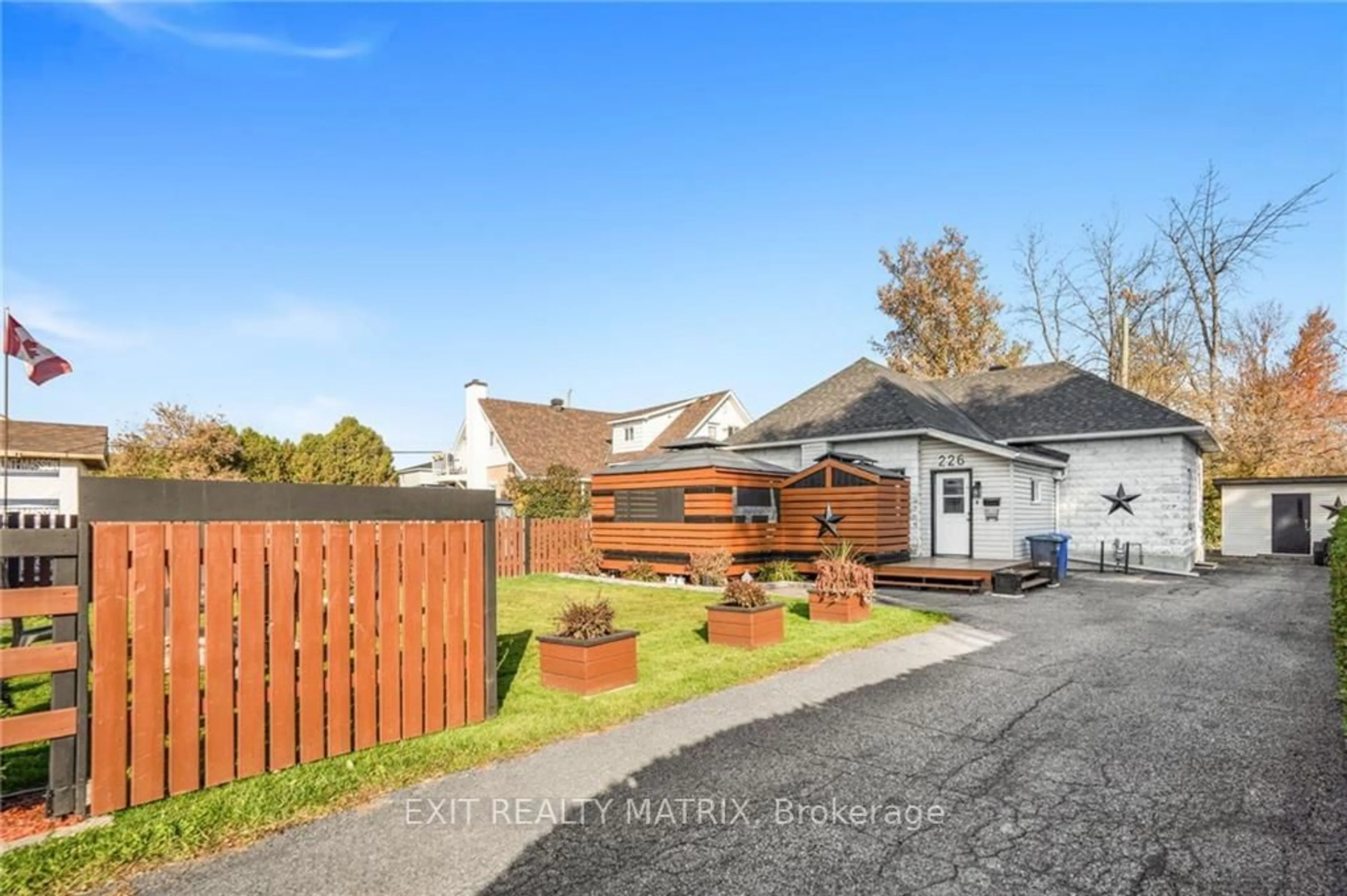 Frontside or backside of a home, the fenced backyard for 226 BON PASTEUR St, Hawkesbury Ontario K6A 2J4