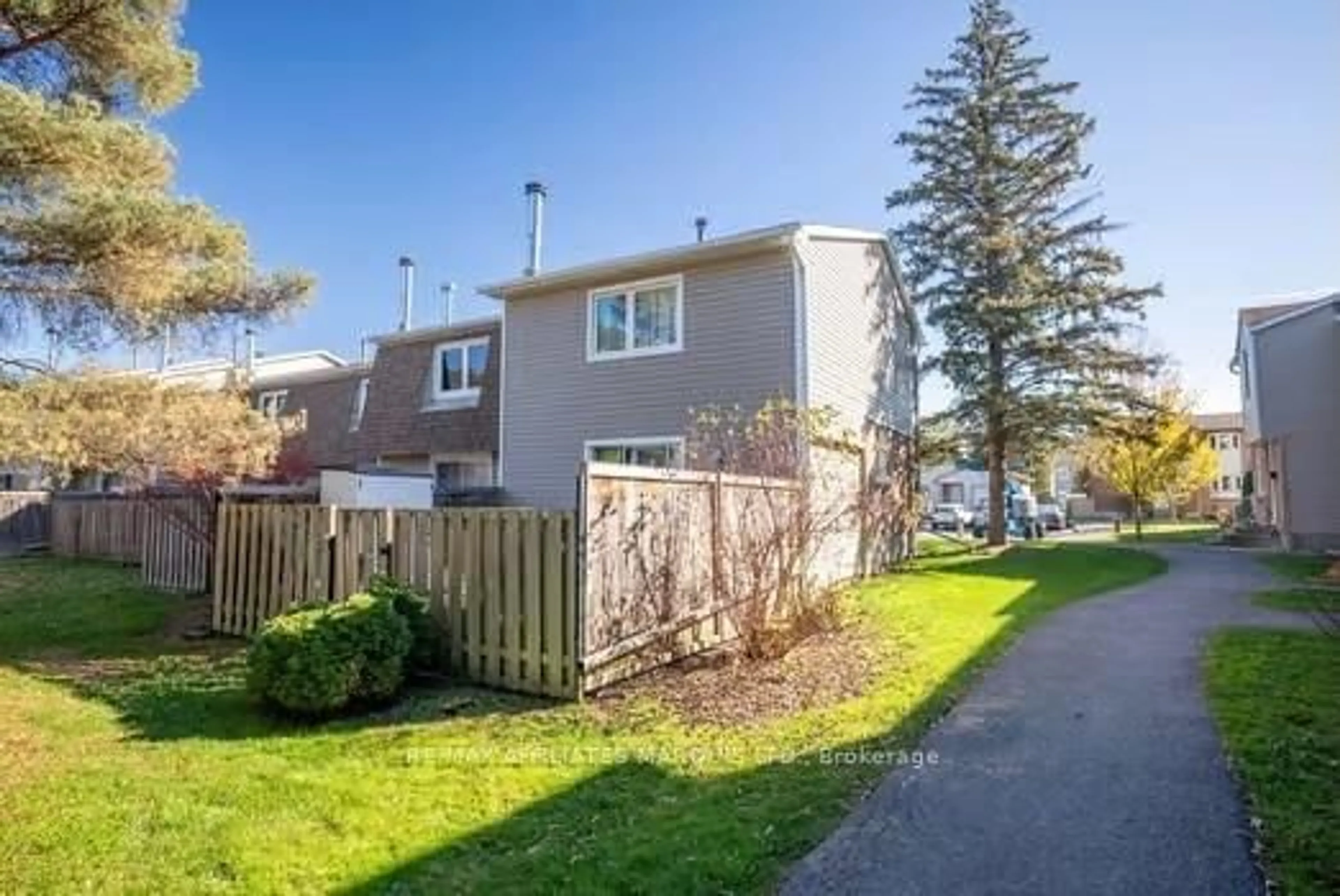 A pic from exterior of the house or condo, the fenced backyard for 1712 LAMOUREUX Dr #A, Orleans - Cumberland and Area Ontario K1E 2N2