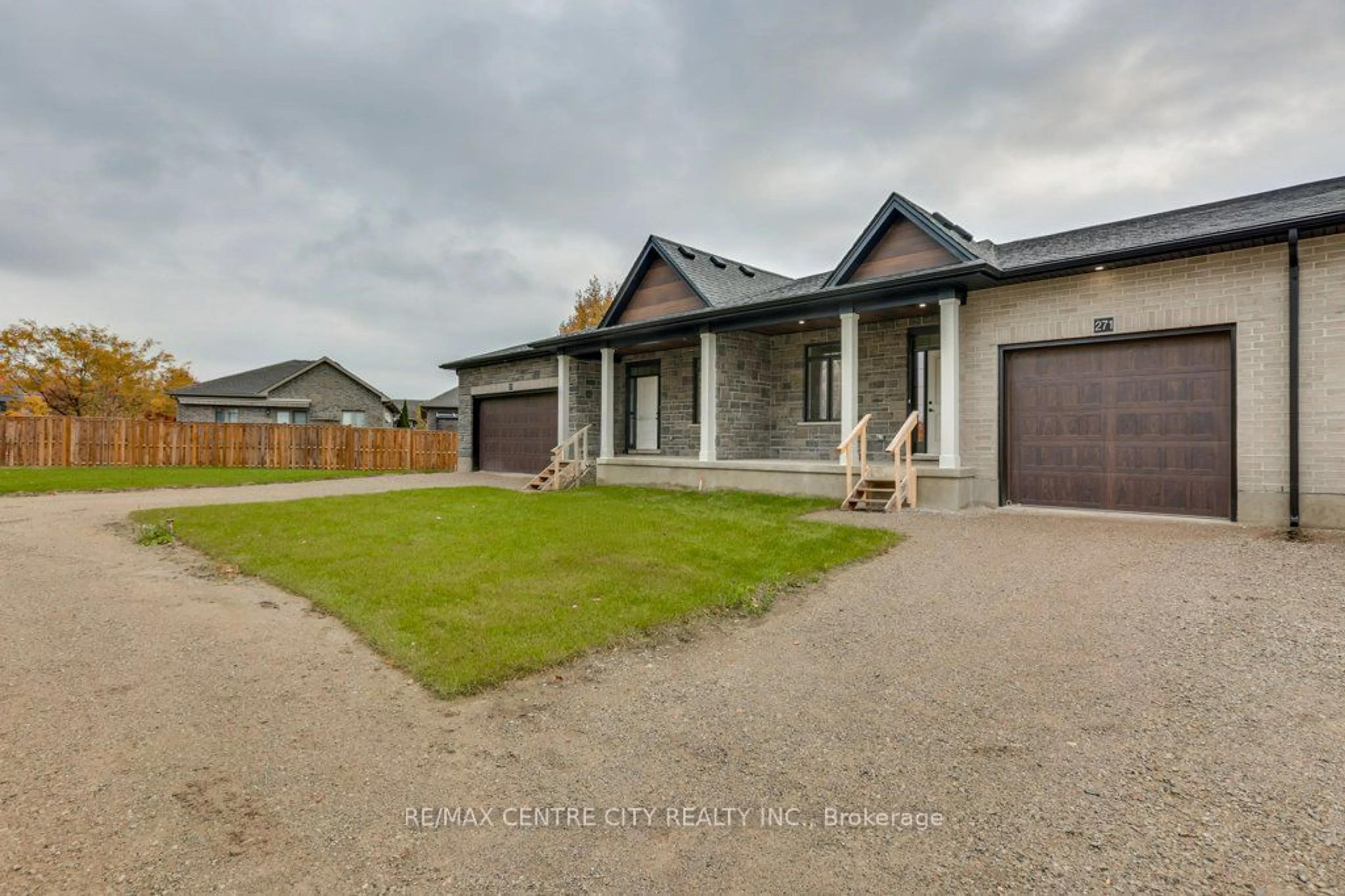 Frontside or backside of a home, the fenced backyard for 271 South Carriage Rd, London Ontario N6H 0B5