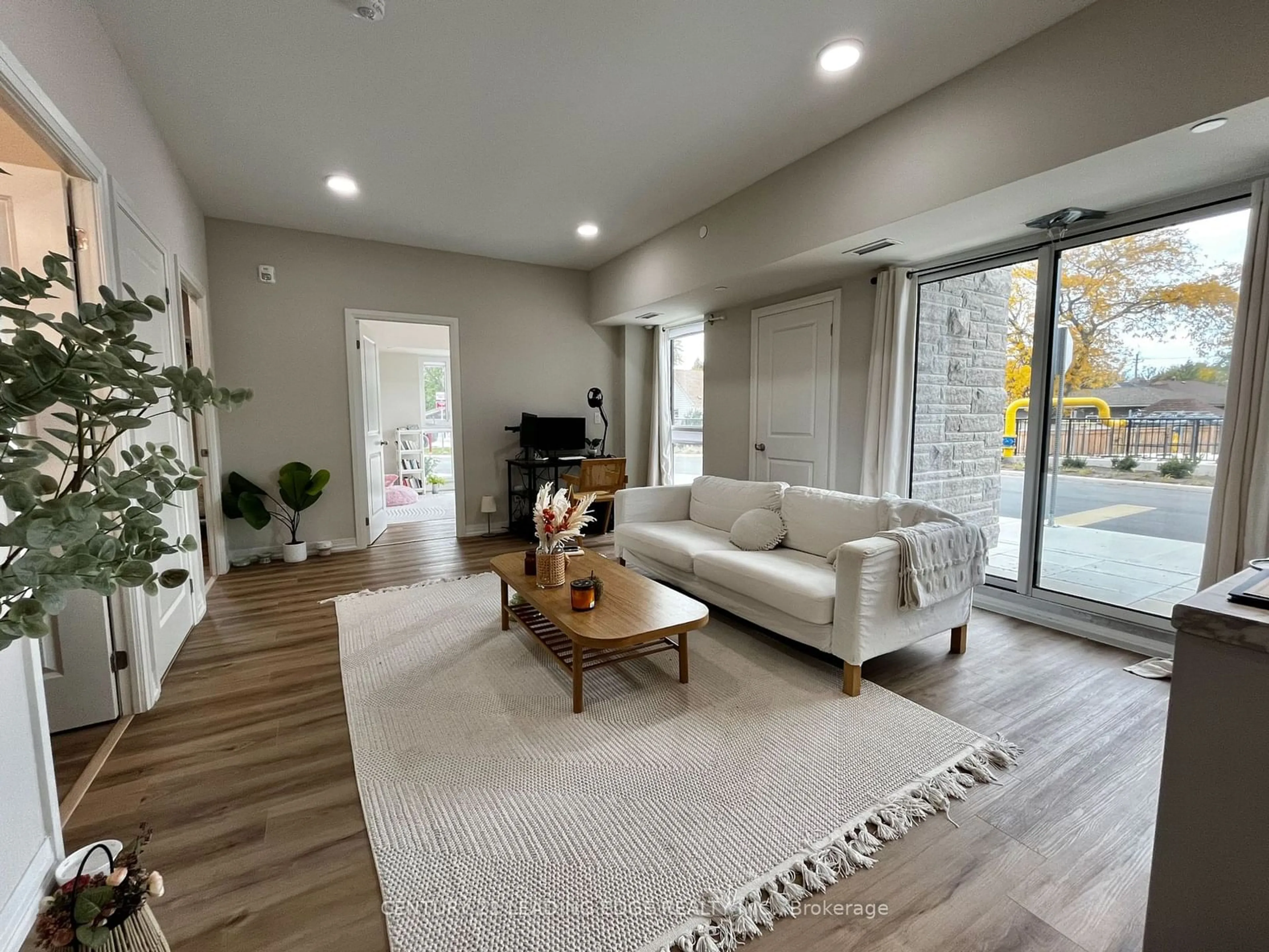 Living room, wood floors for 50 Herrick Ave ##115, St. Catharines Ontario L2P 2T9