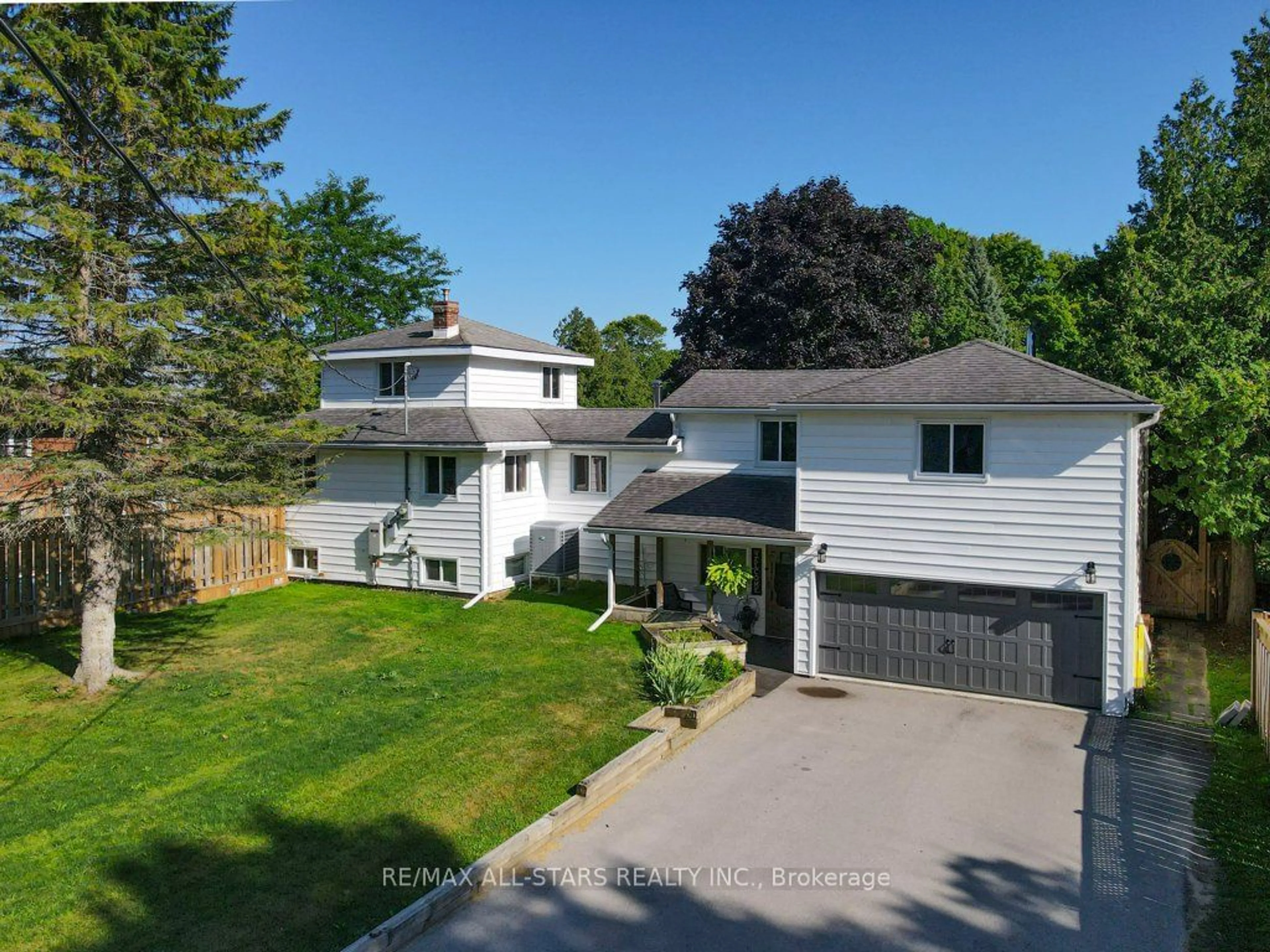 Frontside or backside of a home, the fenced backyard for 48 North Bayou Rd, Kawartha Lakes Ontario K0M 1N0