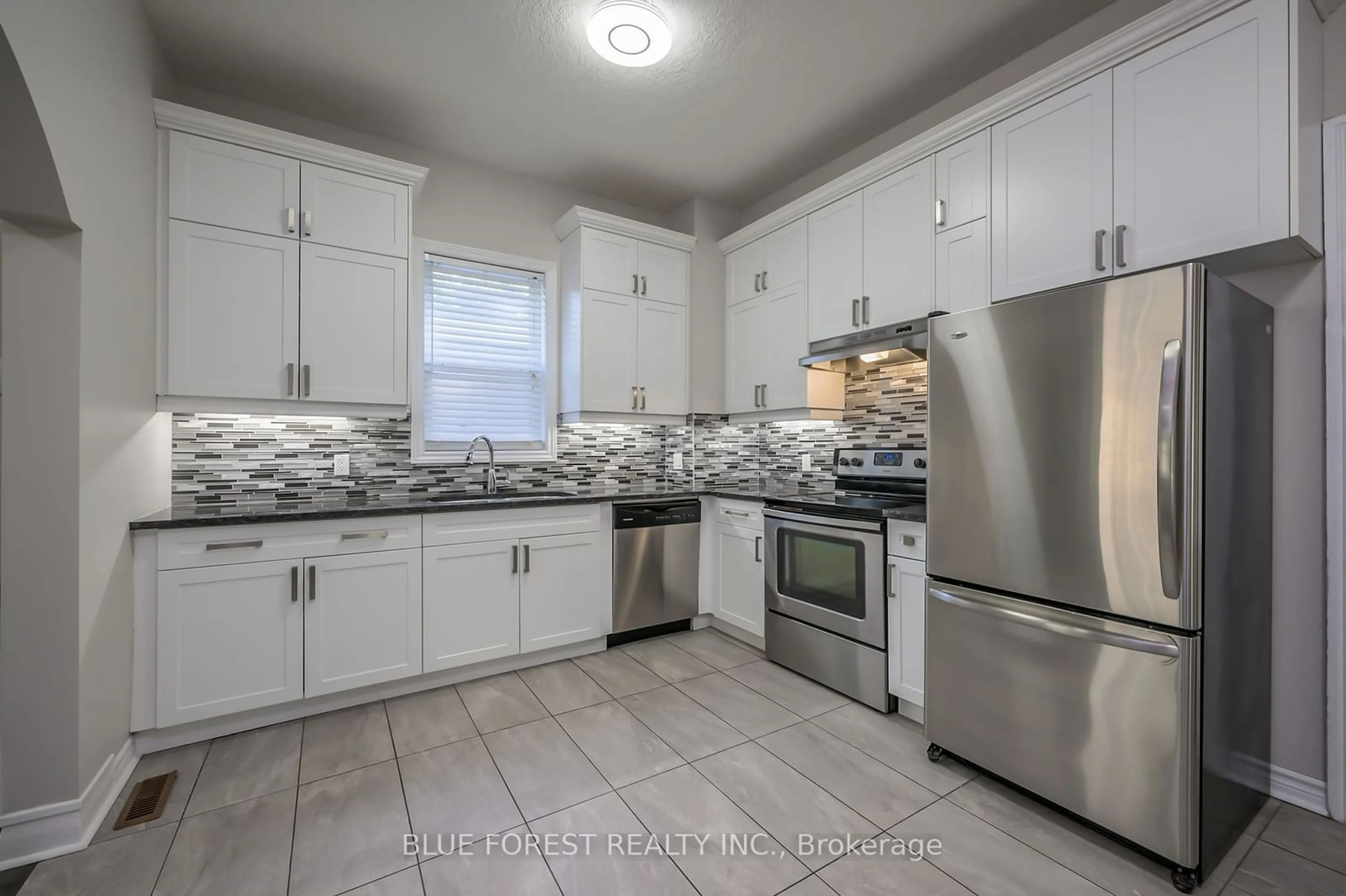 Open concept kitchen for 175 Sydenham St, London Ontario N6A 1W2