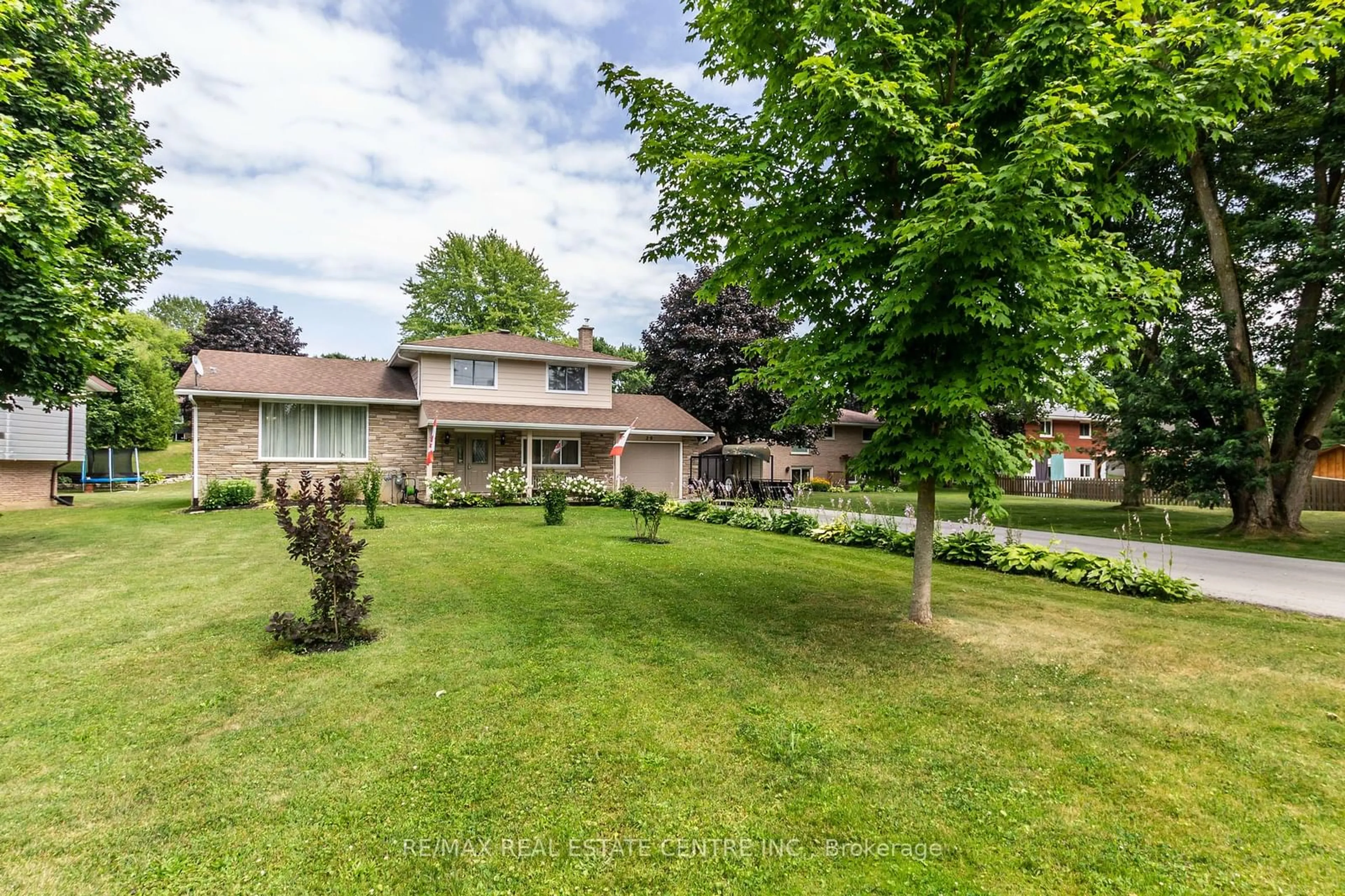 Frontside or backside of a home, the fenced backyard for 20 Ridout St, Brockton Ontario N0G 2V0