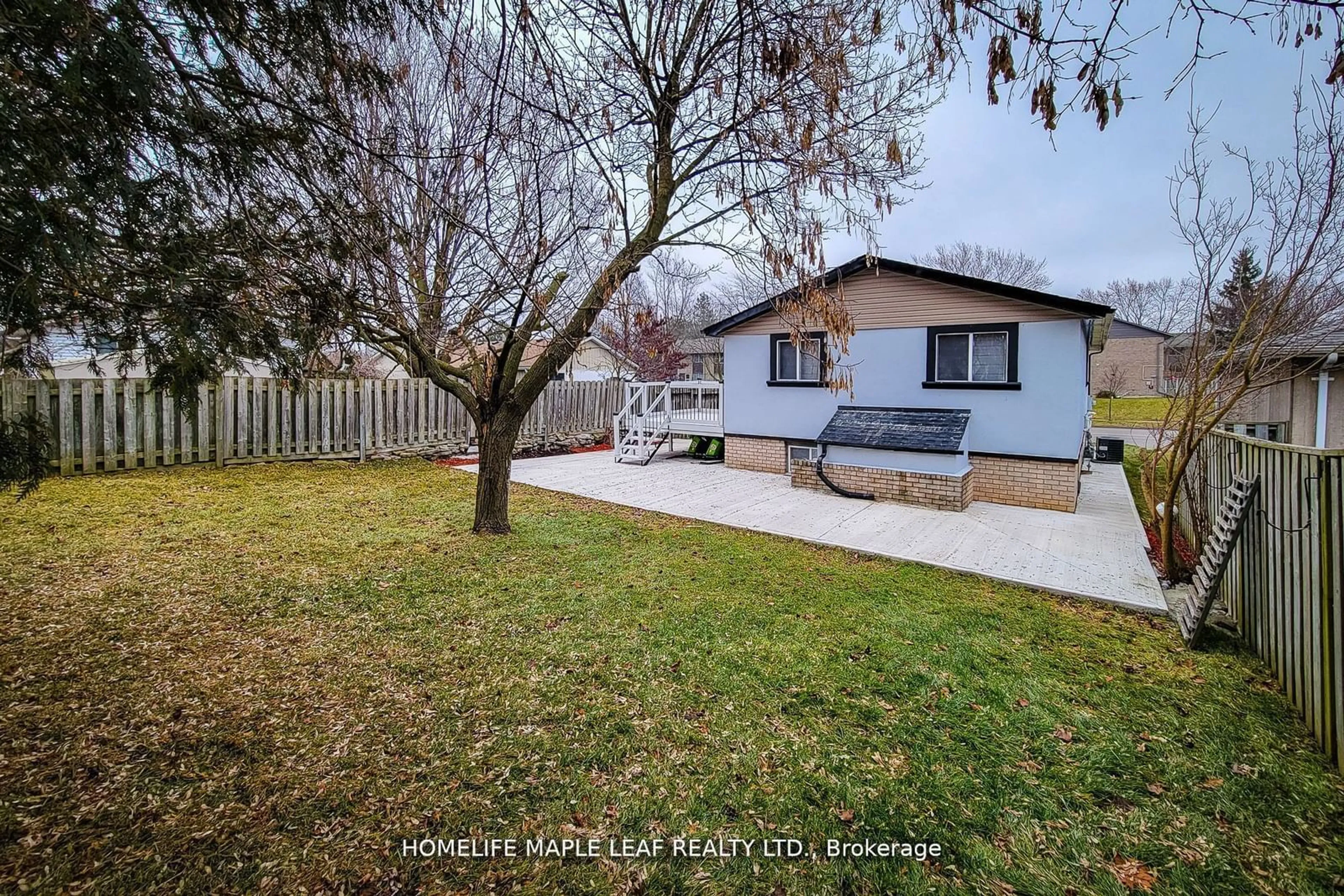 Frontside or backside of a home, the fenced backyard for 211 Dunsdon St, Brantford Ontario N3R 7H7